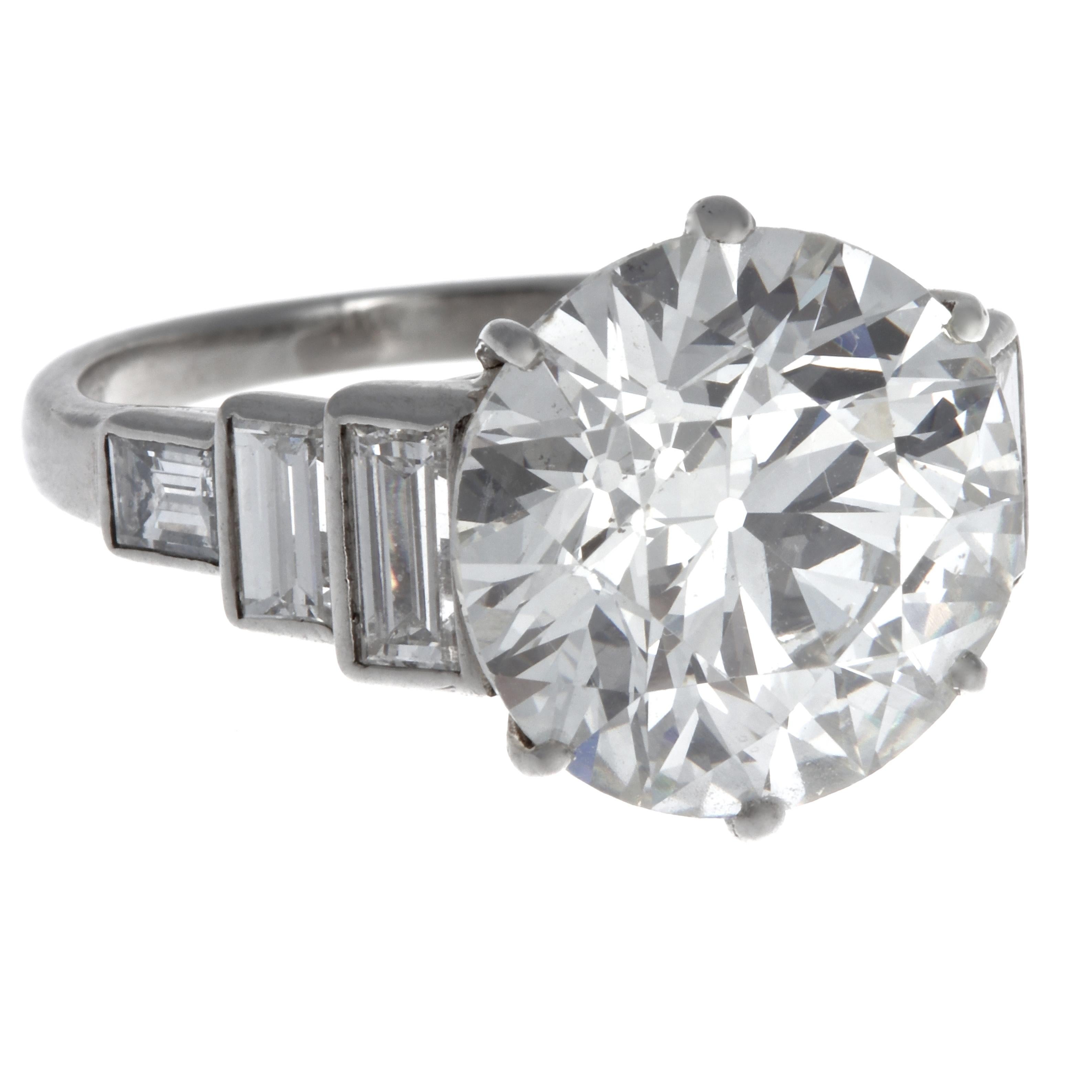Looking for a statement engagement ring or a solid upgrade? This is the one. Art Deco diamond platinum ring. The center stone is GIA certified old European cut diamond, 5.50 carats, I color SI1 clarity (#6214079060).  Accented by six baguette