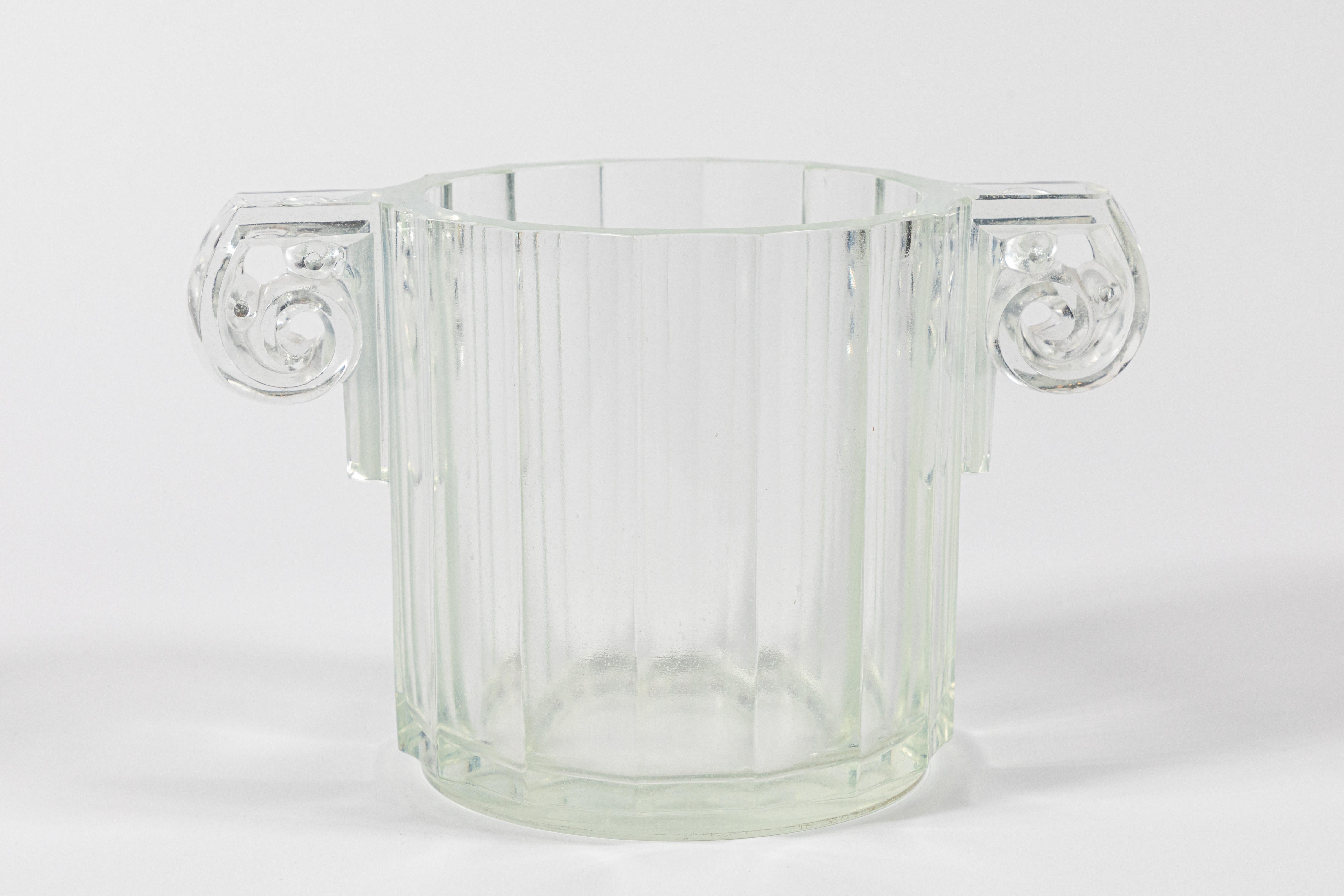 This is a French Art Deco ice bucket, wine cooler, or short vase in pressed opalescent glass. Classically inspired, it's a 