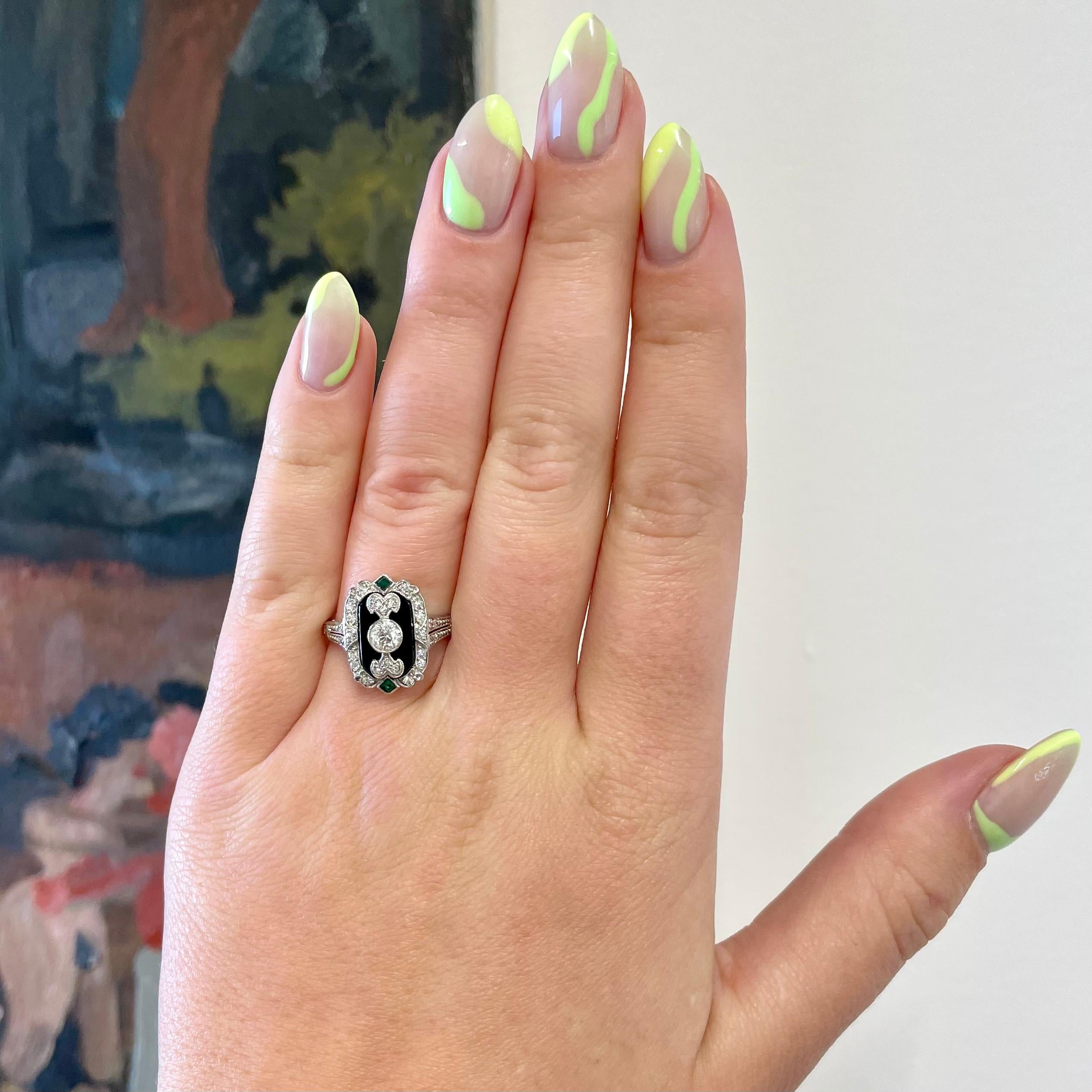 Talk about a dramatic Art Deco moment! This is a ring like no other. A ring that will attract admirers and highlight your daring personality. This is a vintage tribute to the iconic Art Deco era that will inspire you to create and be fabulous for