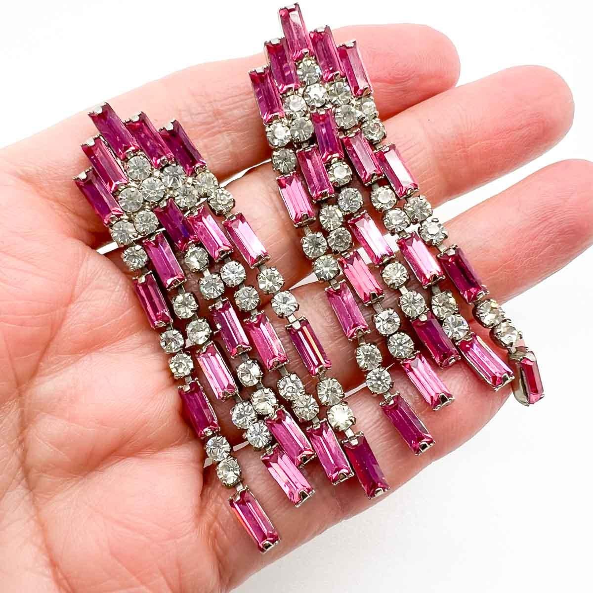 Delightful Vintage Pink Baguette Earrings. Cascades of pink and white baguette cut crystal stones create the perfect art deco style statement.
An unsigned beauty. A rare treasure. Just because a jewel doesn’t carry a designer name, doesn’t mean it