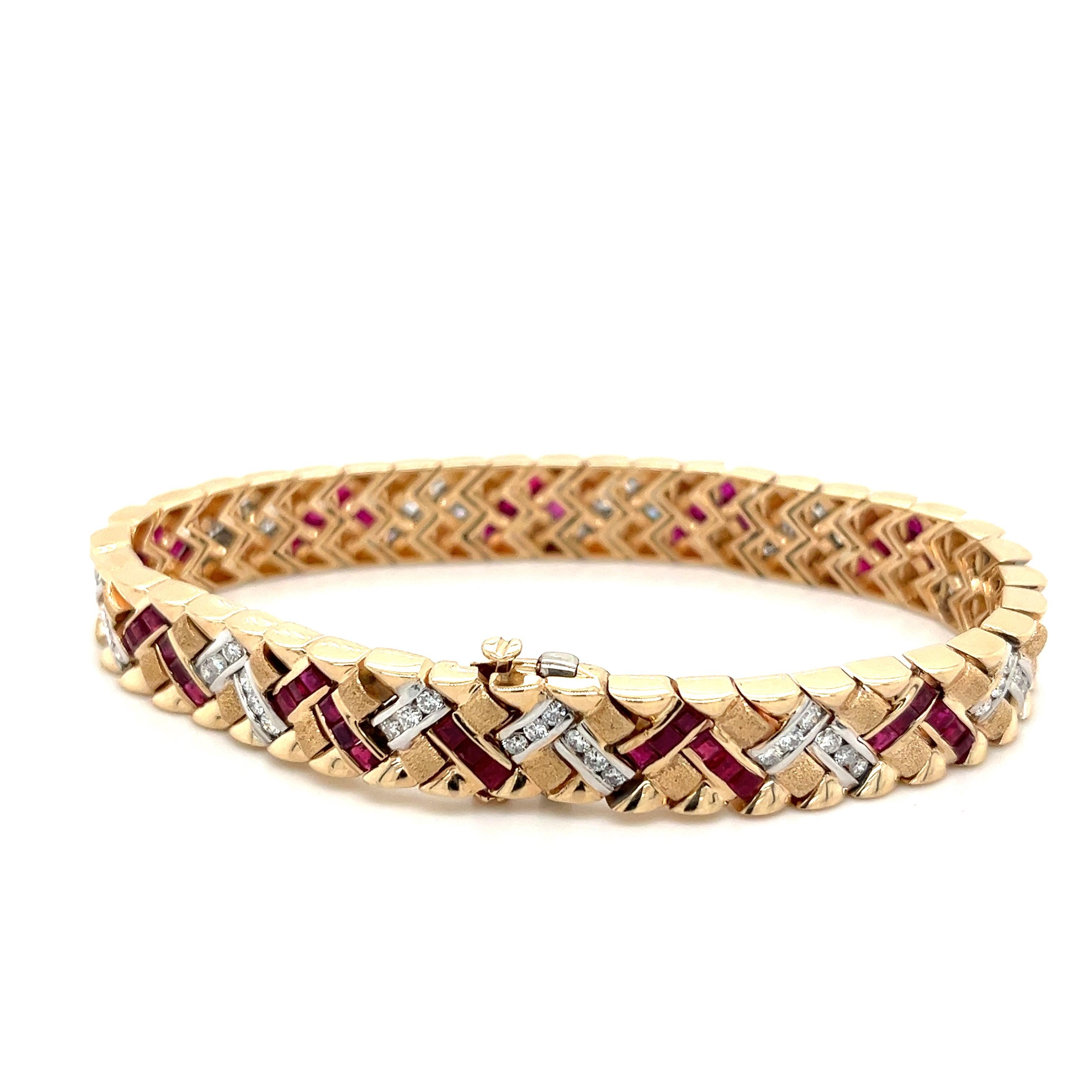 Art Deco-inspired 14k solid yellow gold bracelet set with 126 natural Rubies and Diamonds. 

This bracelet is a vintage masterpiece—a one-of-a-kind piece with the quintessential art deco symmetrical pattern. Handmade with a gorgeous mix of a