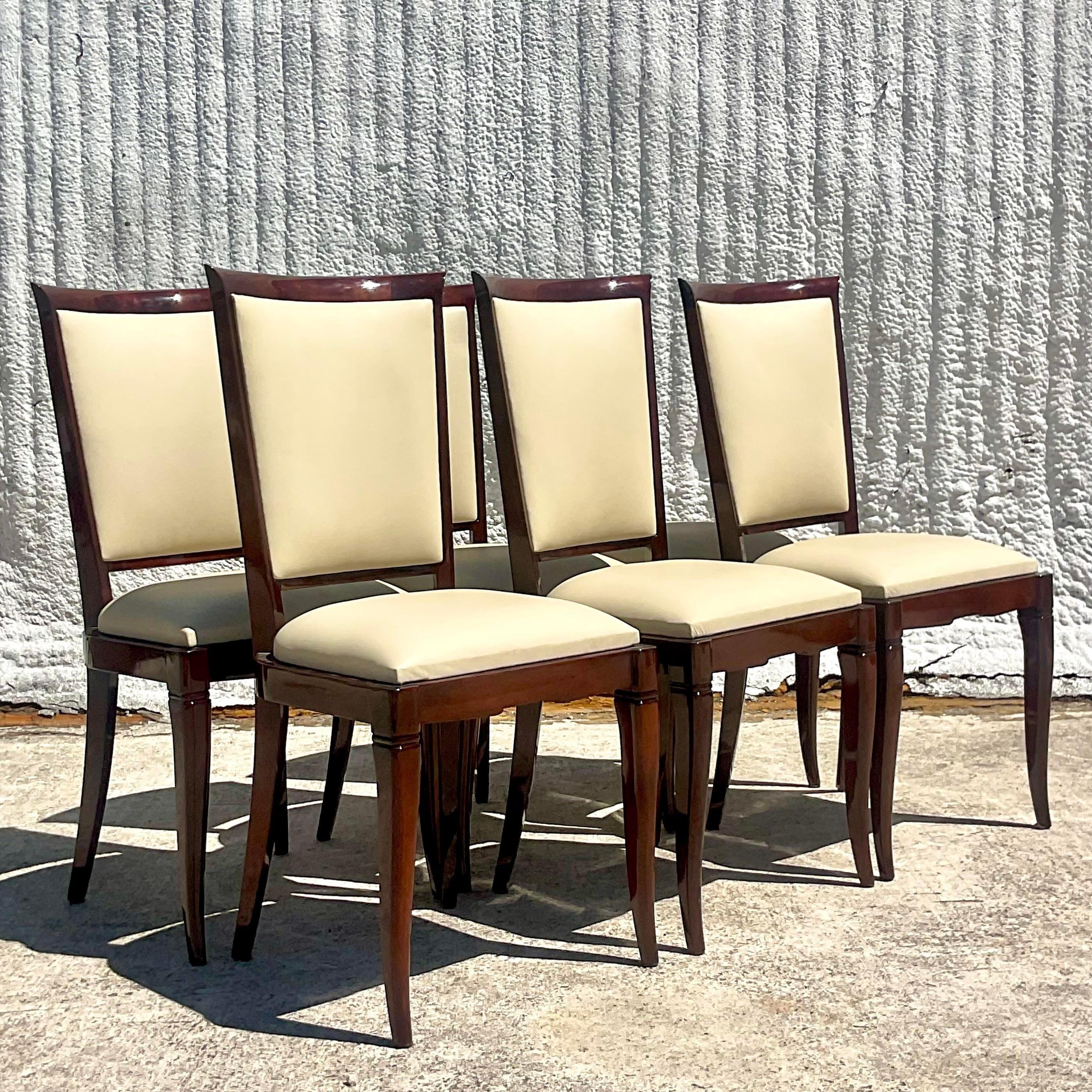 An extraordinary set of six vintage Art Deco dining chairs. Beautiful slender frame with a full wood back and cabriolet legs. Gorgeous smooth leather in a chic off white. Fully restored with a high gloss sheen. Acquired from a Palm Beach estate.