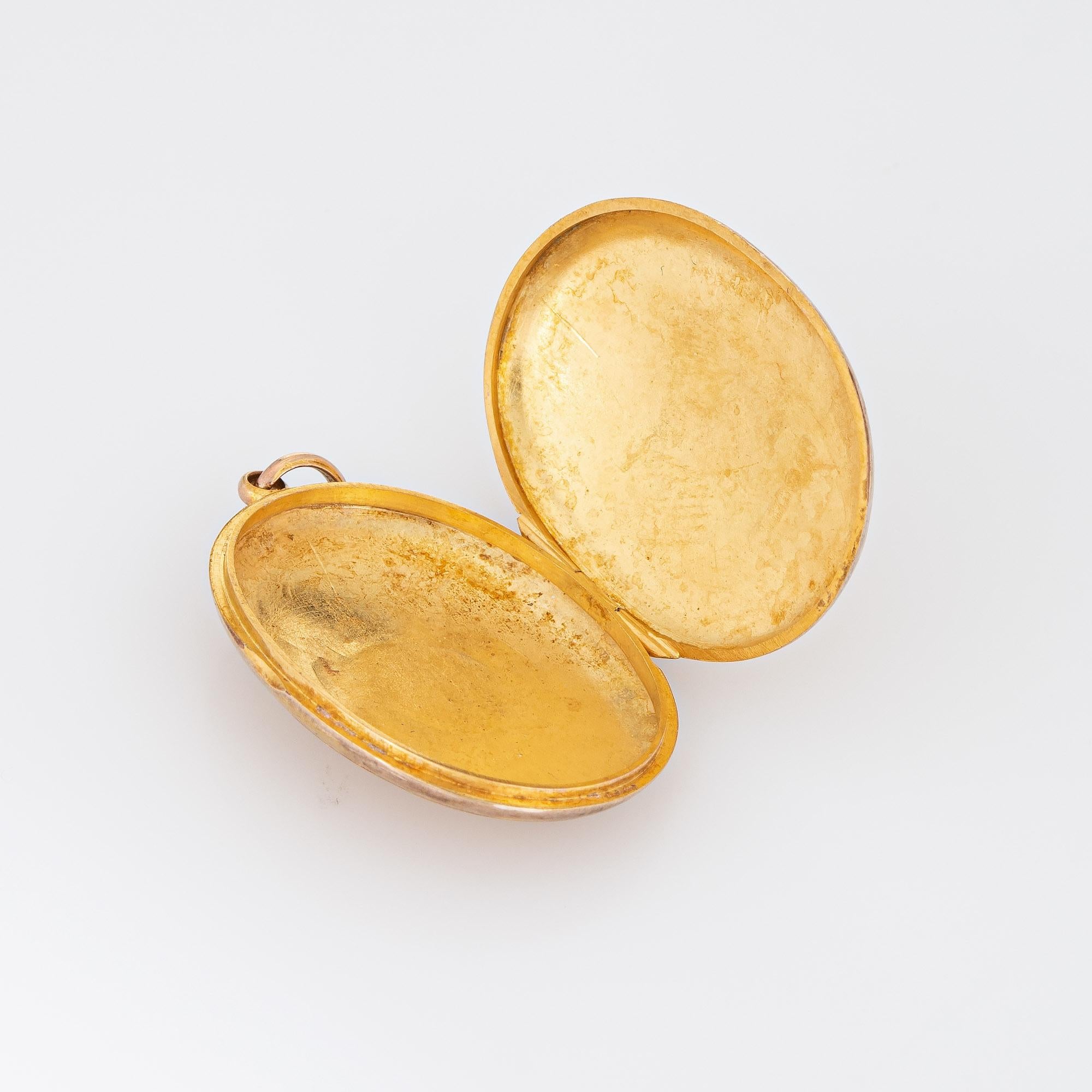Elegant and finely detailed vintage Art Deco era locket (circa 1918) crafted in 9k yellow gold. 

The oval shaped locket features a decorative engraved floral pattern. Likely given as a wedding or anniversary gift, the locket is engraved 'From A.D