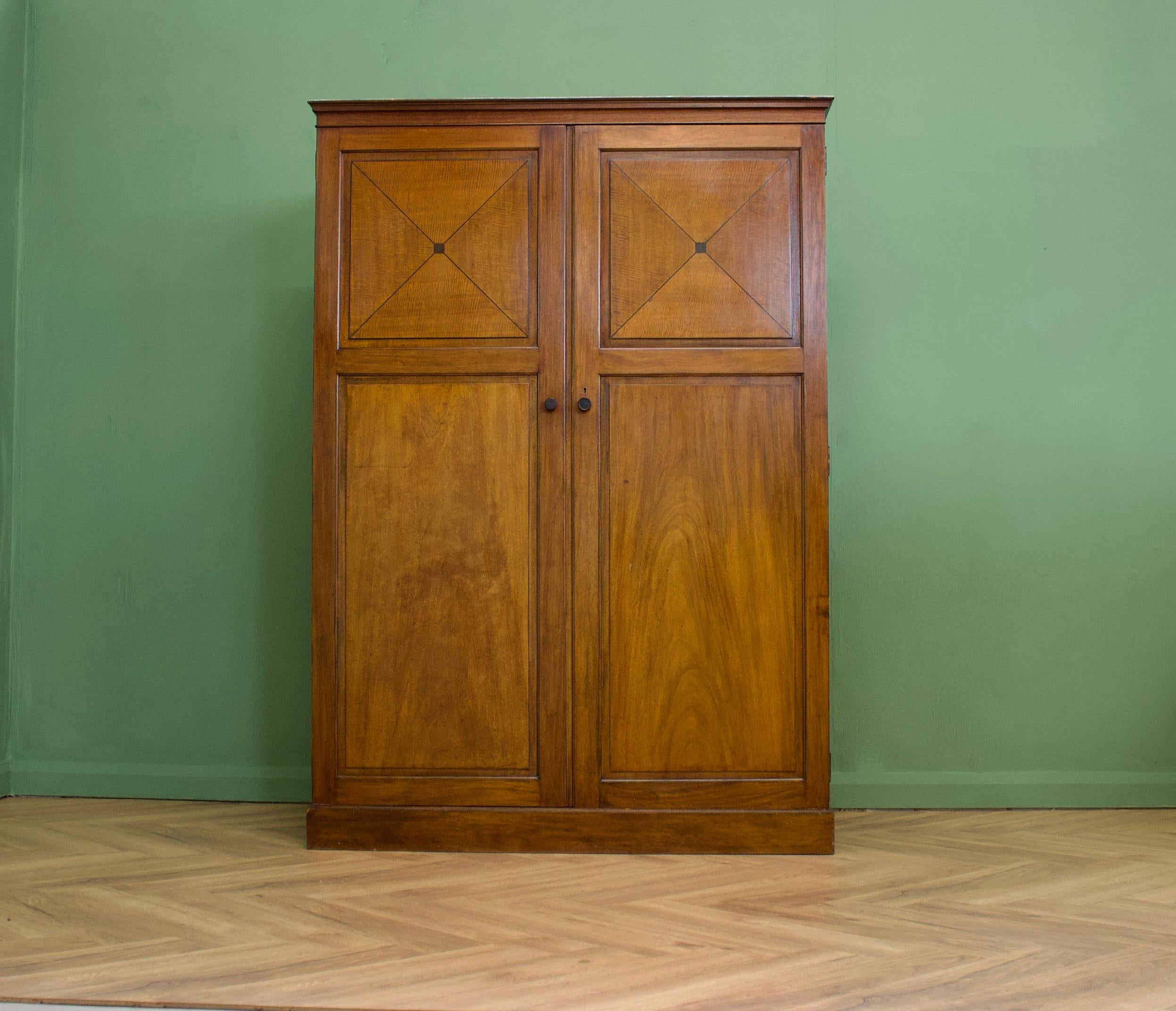 A Heal and Son Art Deco fitted out mahogany wardrobe
Featured in the 1936 Heals catalogue - named 'The Orderly'
Possibly designed by Ambrose Heal - due to the piece having a name as opposed to just a number in the catalogue - and shares some