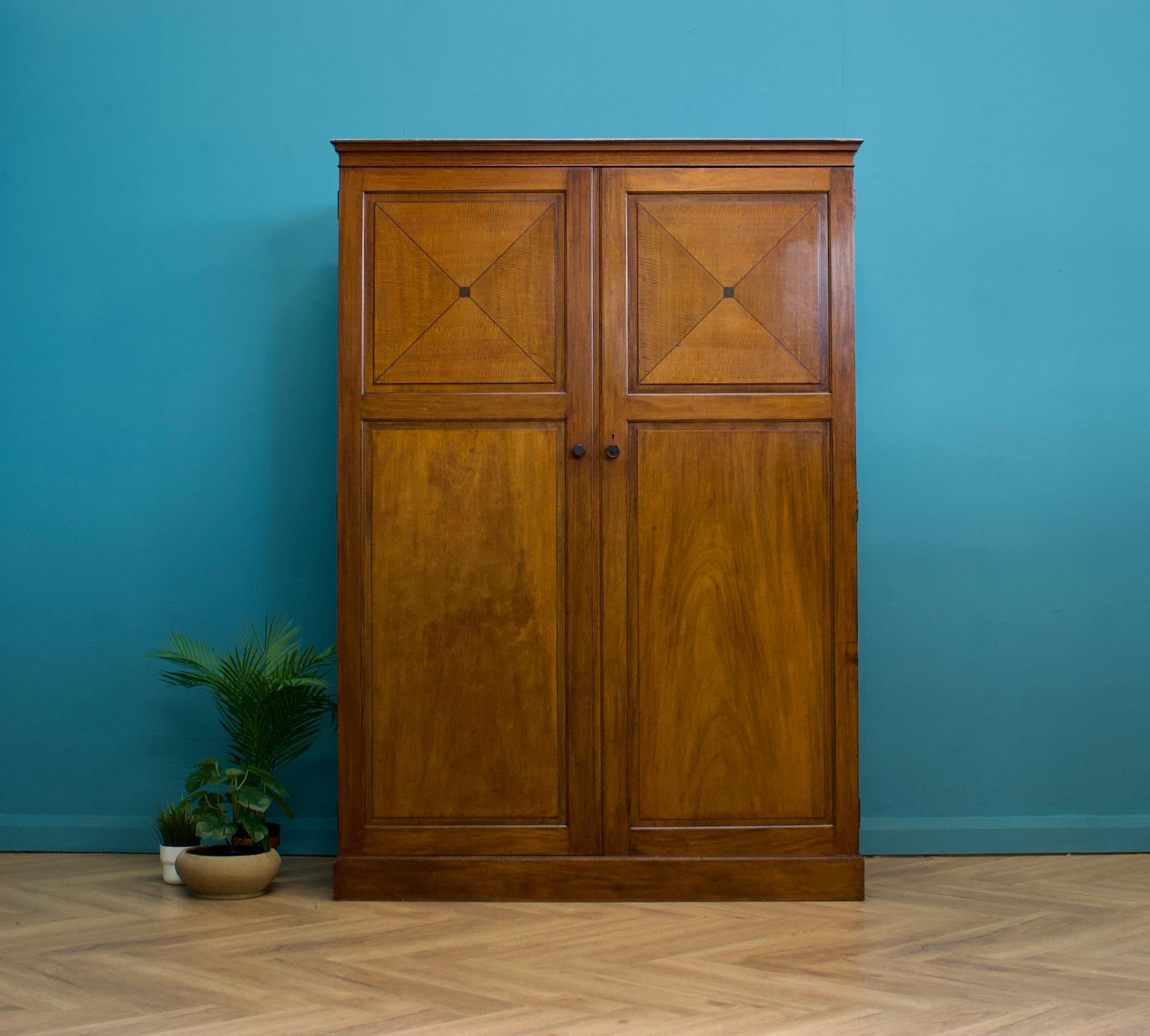 A Heal and Son Art Deco fitted out mahogany wardrobe
Featured in the 1936 Heals catalogue - named 'The Orderly'
Most probably designed by Ambrose Heal - due to the piece having a name as opposed to just a number in the catalogue - and shares some