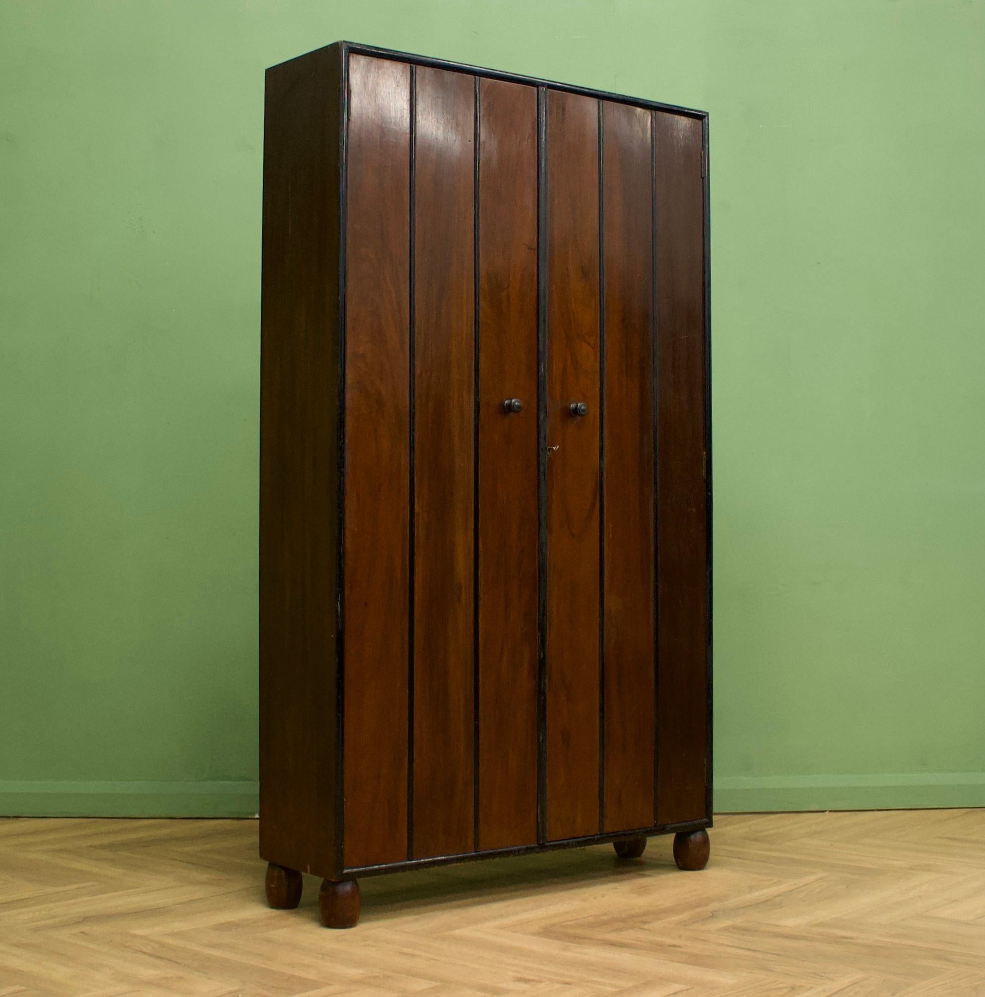 A beautiful quality Art Deco mahogany hanging wardrobe from Heals, circa 1930s (unmarked but features in Heals Middle Class Furnishing Catalogue by David & Charles p 50 no 633)


The narrow width makes it a perfect hall cupboard as it features