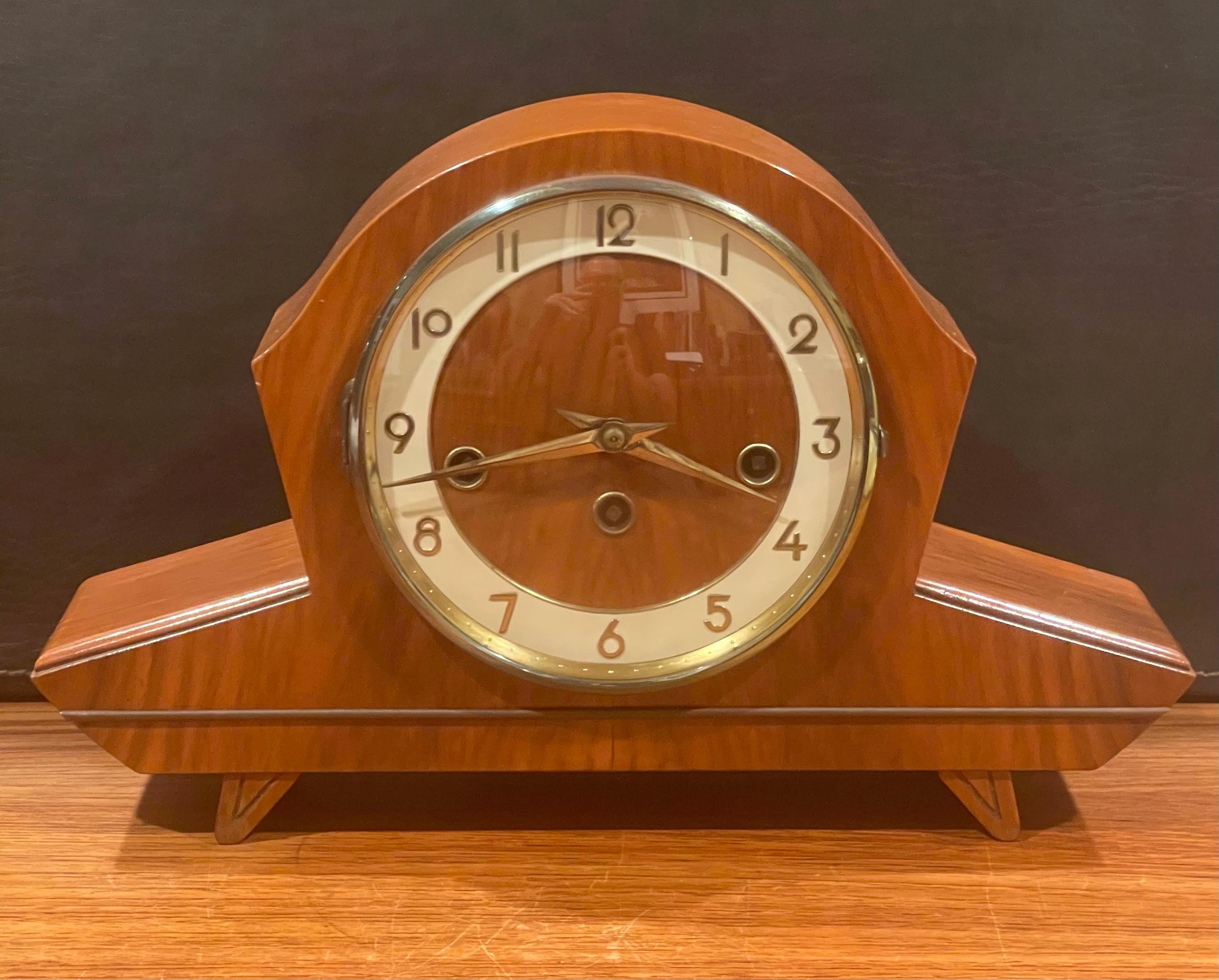 Elegant vintage Art Deco mantel clock with a German Hermie movement, circa 1950s. The clock is in very good vintage condition and holds accurate time. The chimes mechanism of the clock does not work. The clock has a great look and the dial is