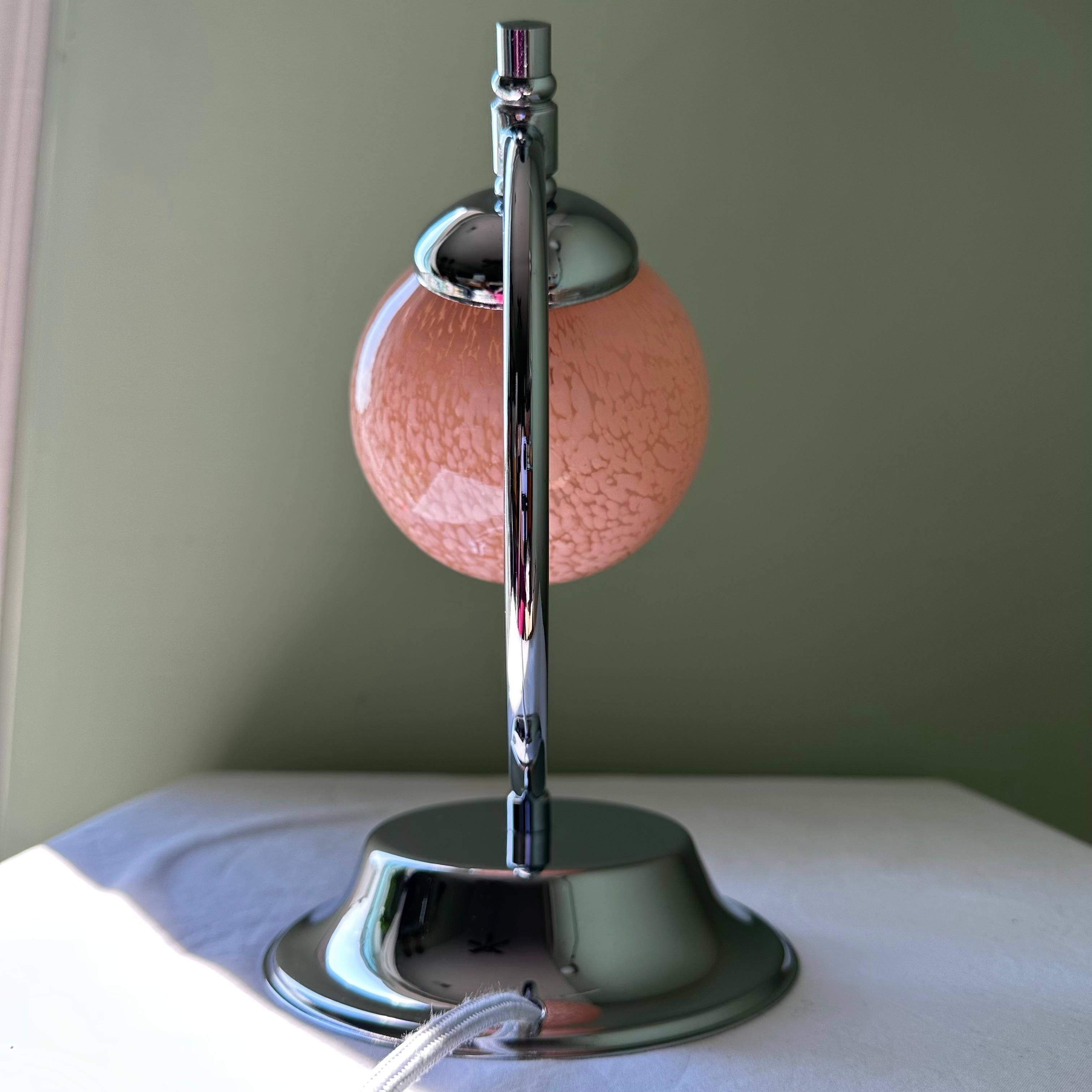 German Vintage Art Deco Modernist Style Chrome and Pink Glass Saturn Globe Table Lamp For Sale