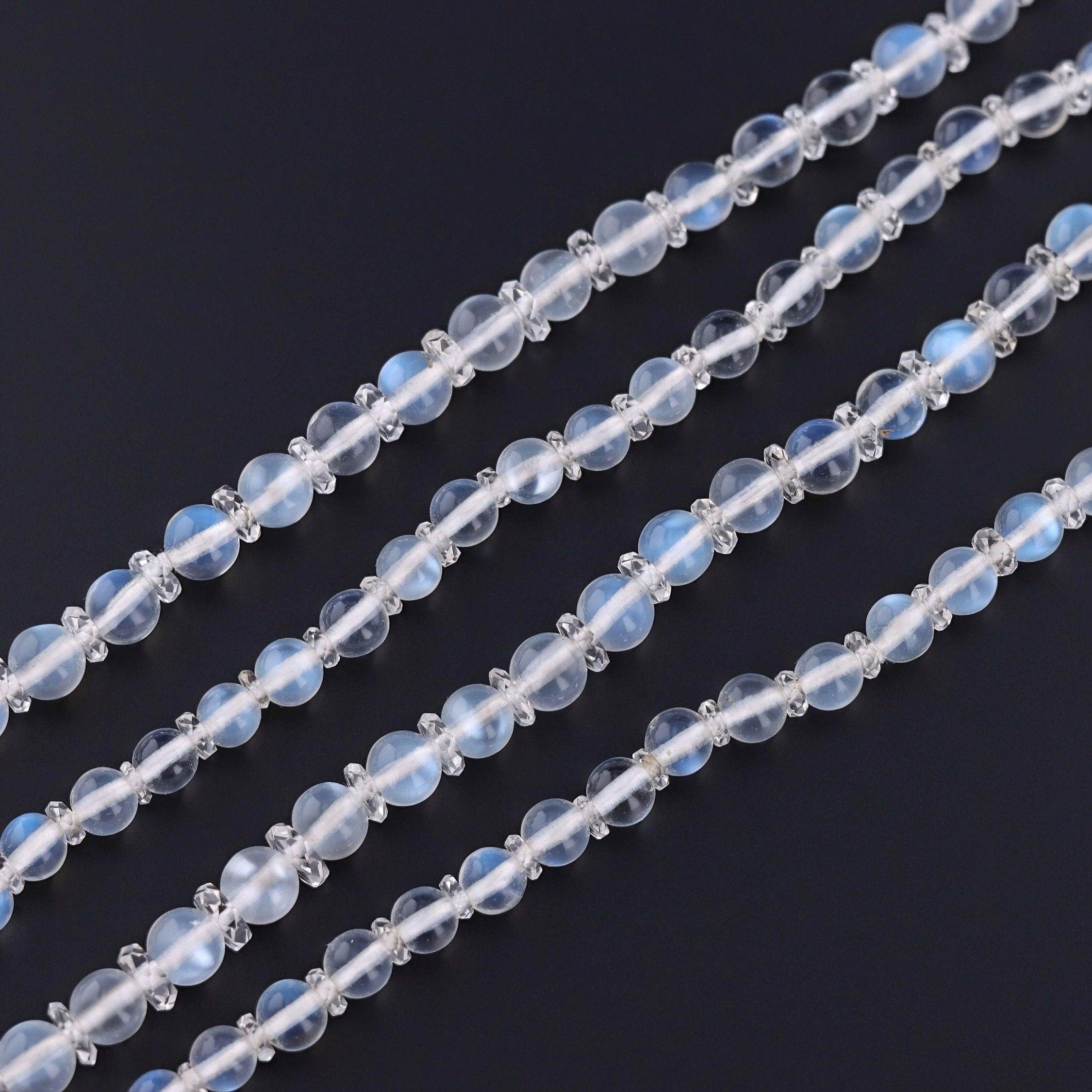 An elegant moonstone bead necklace with many styling options!

This vintage Art Deco necklace (circa 1920-1930) is comprised of vibrant moonstone beads with flashes of blue schiller interspersed with faceted rock crystal rondelles. The ornate clasp