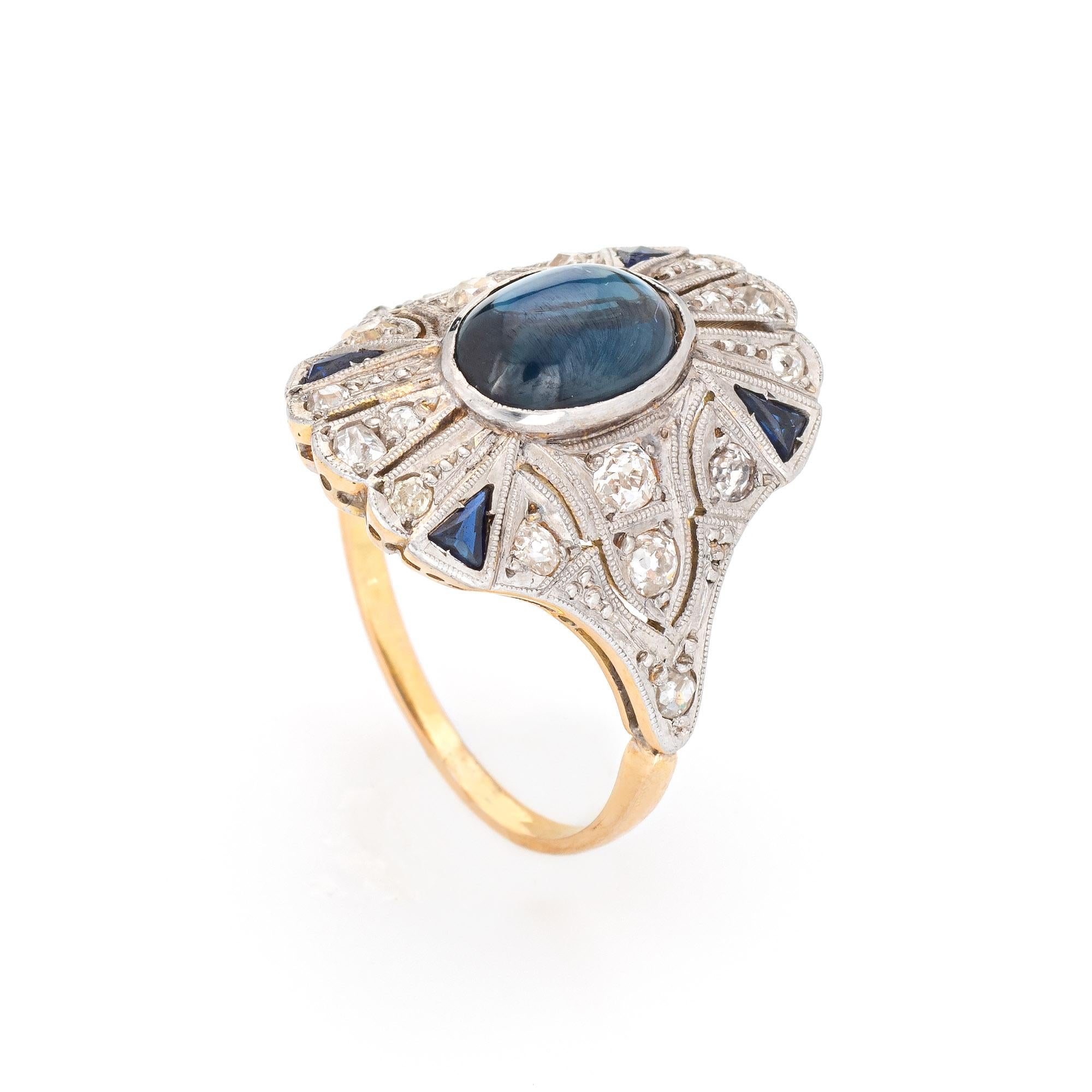 Stylish 2.40ct natural cabochon sapphire & diamond ring crafted in 18k yellow gold & platinum. 

Cabochon cut natural star sapphire, 2.40ct (9.5 x 6.5 x 3.6mm), dark green-blue color, nearly flawless, good polish and symmetry, Australian origin, no