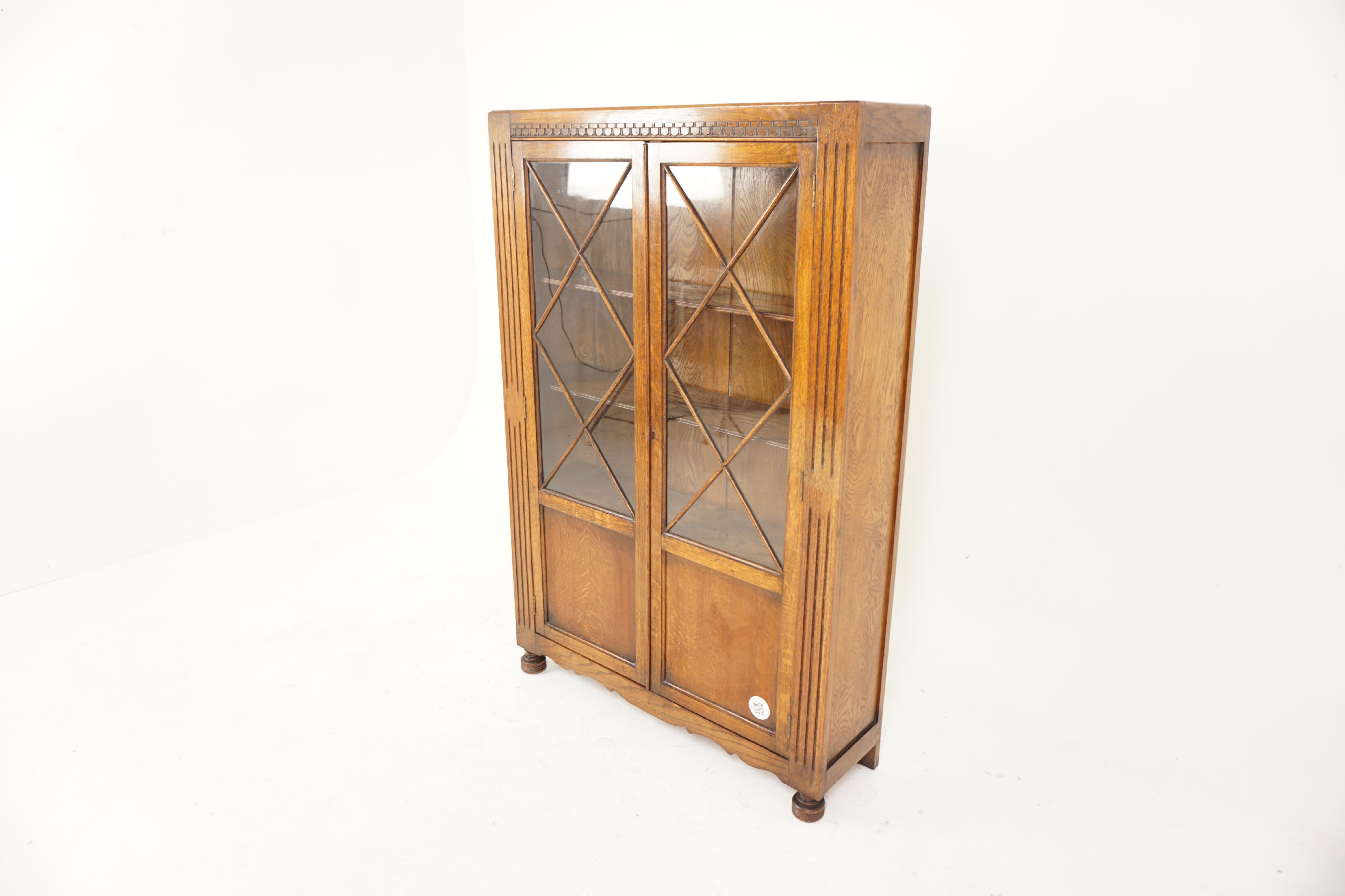 Vintage Art Deco oak 2 door bookcase, display cabinet, Scotland 1930, H733

Scotland 1930
Solid Oak + veneers
Original Finish
Rectangular moulded top
Carved frieze underneath
Pair of original glass with triangle moulding to the front
Opens to reveal