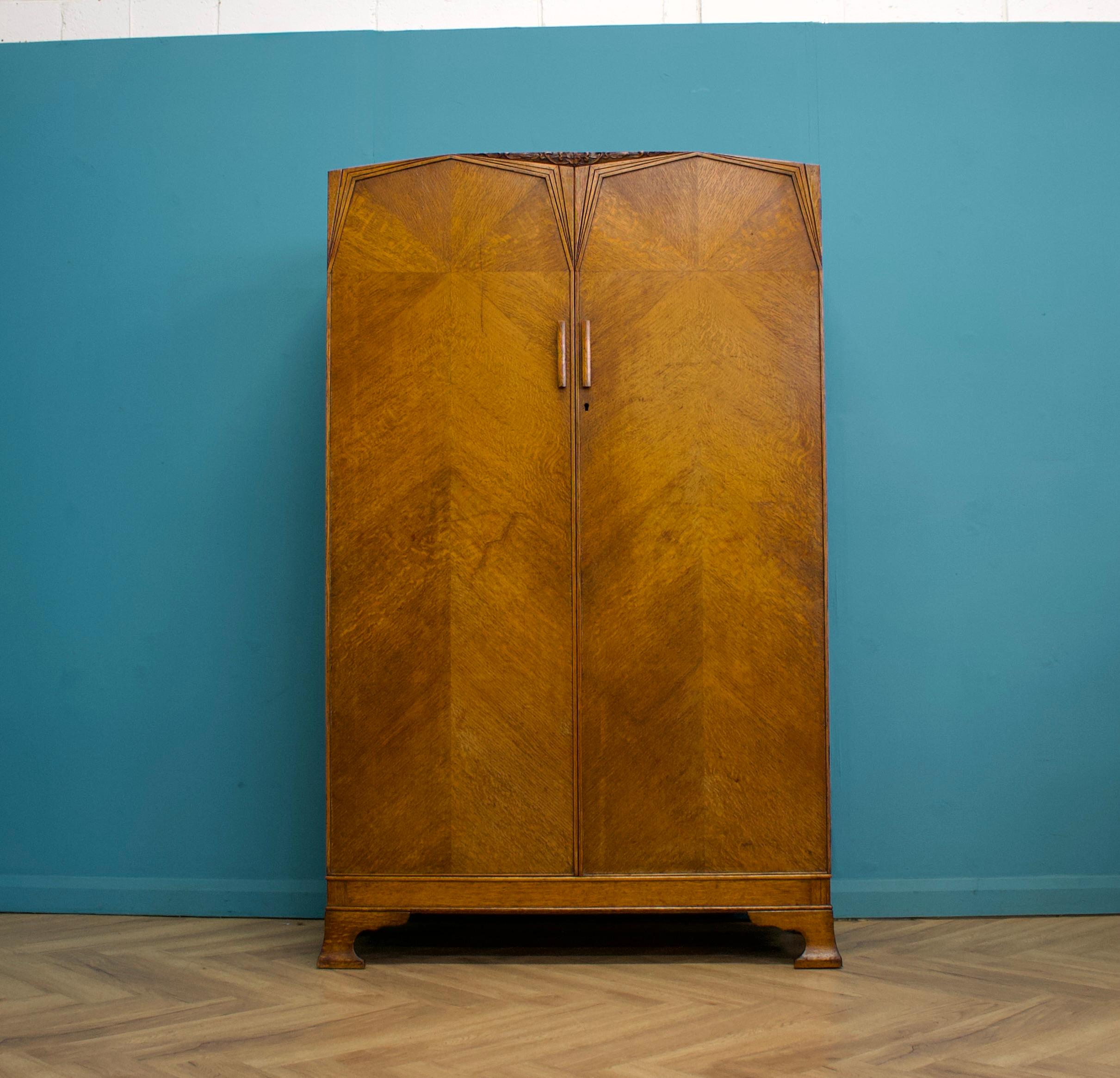 This high quality vintage oak Art Deco wardrobe, circa 1930s.

Inside, it is beautifully fitted out with a clothes and show rail and a shelf.