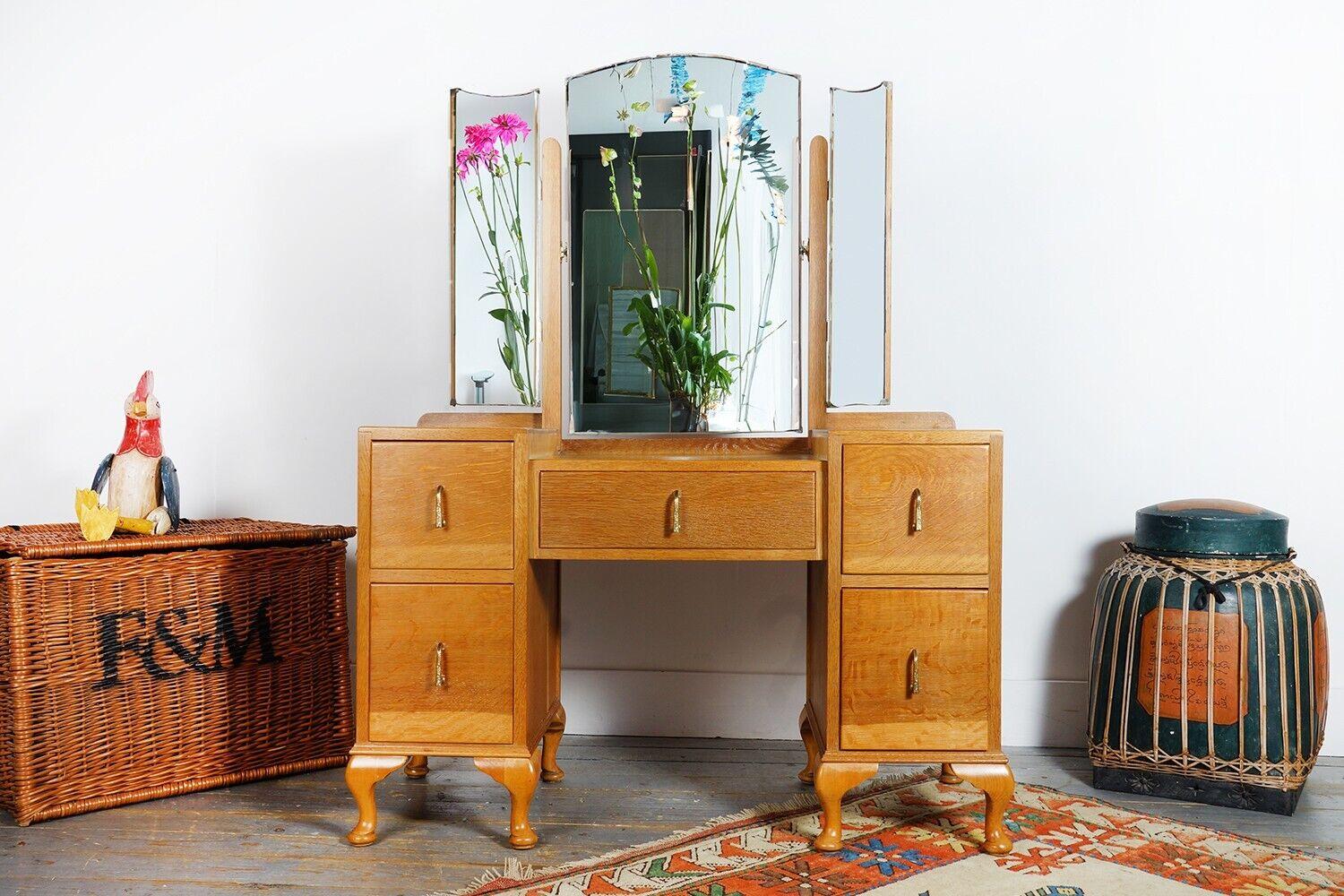 Art Deco Dressing Table

1930s oak mirrored dressing table sat on cabriole legs. Features five drawers and three adjustable mirrors.

Art Deco is a prominent and influential design style that emerged in the early 20th century, reaching its peak