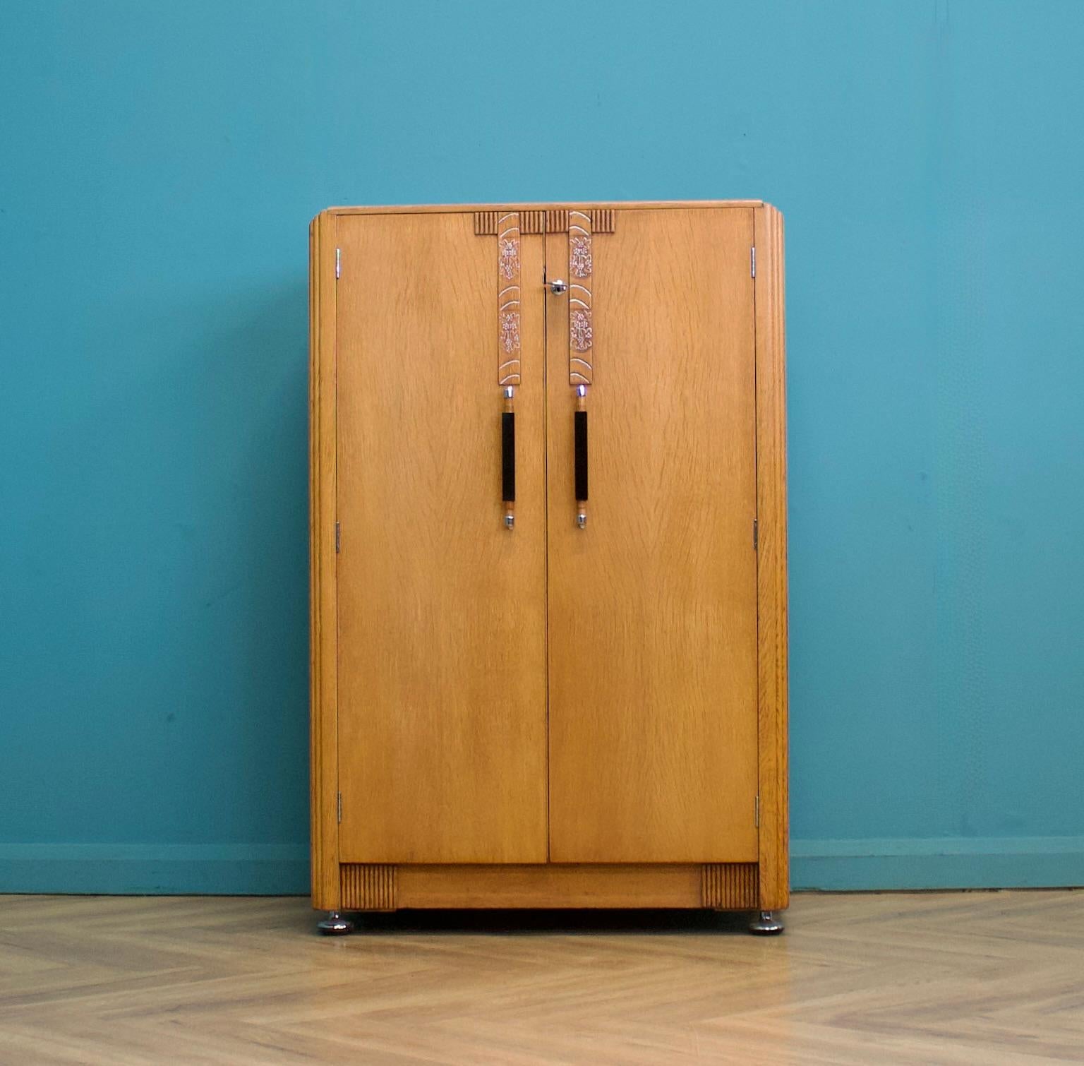 This quality vintage oak tallboy chest from G Plan (E Gomme) is circa 1930s.


Inside, it is beautifully fitted out with oak drawers and a shelf


The matching wardrobe is available to buy on a separate listing.