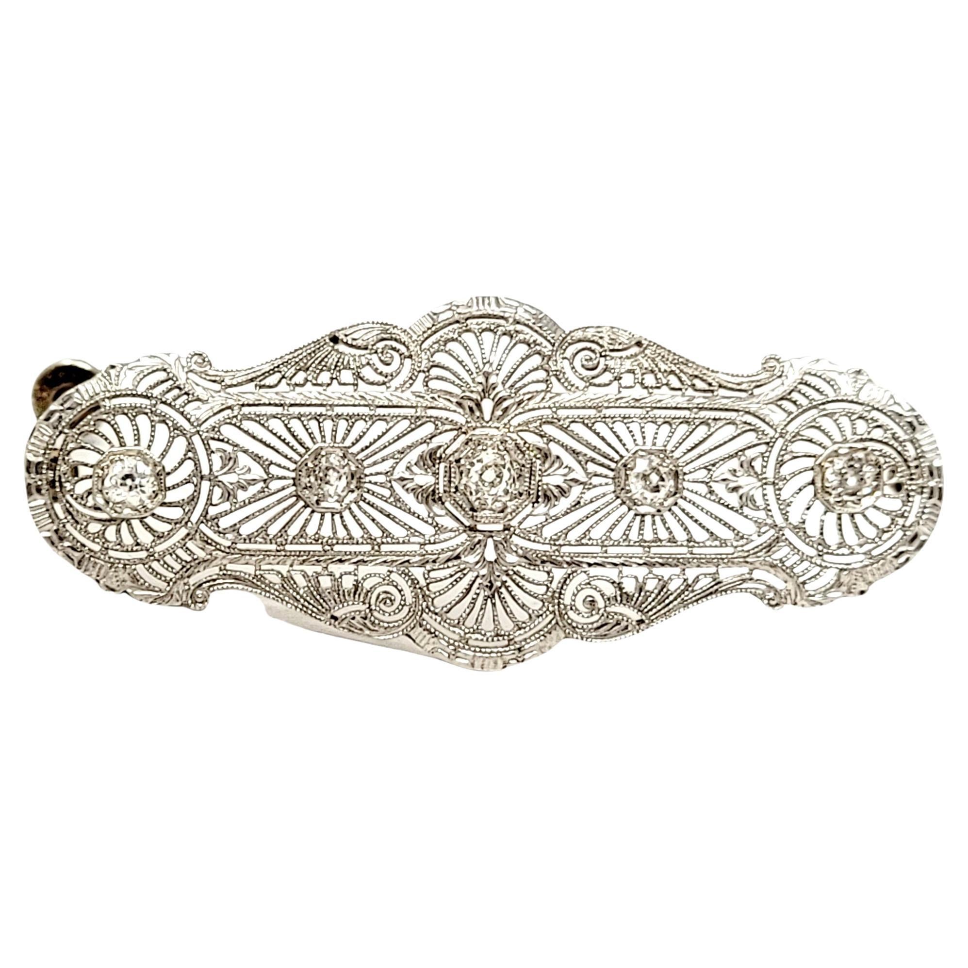 Lovely vintage diamond brooch with delicate open filigree design throughout. 

Metal: 14K White Gold
Closure: Hinged stick pin
Natural Diamonds: .45 ctw 
Diamond Cut: Old Mine
Diamond Color: G-H-I
Diamond Clarity: VS2-I1
Length: 2.16