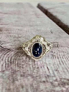 Vintage Art Deco Oval Cabochon Natural Blue Sapphire and Diamond Platinum Ring