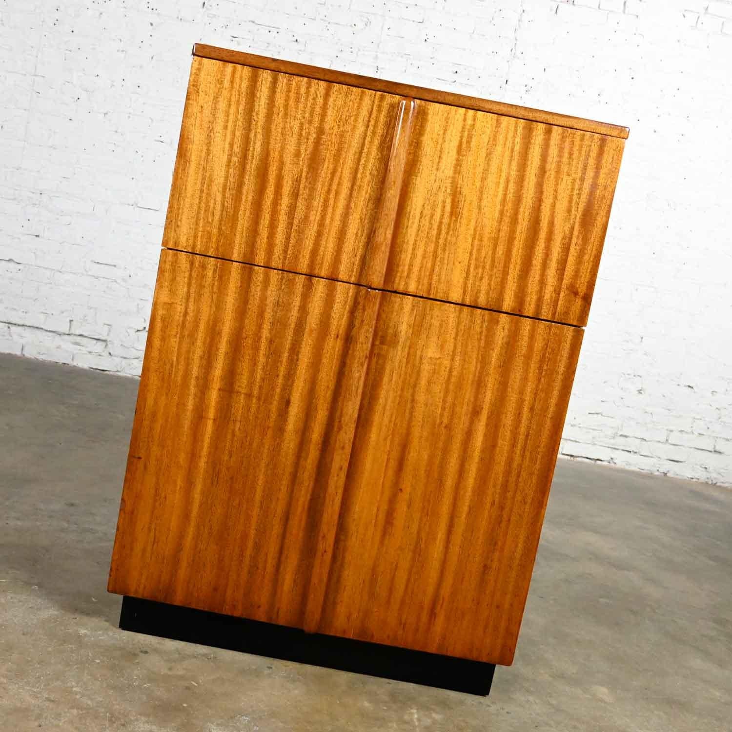 Awesome vintage Art Deco dry bar or liquor cabinet comprised of Philippine mahogany. Beautiful condition, keeping in mind that this is vintage and not new so will have signs of use and wear. We have added a new black painted base. There were several
