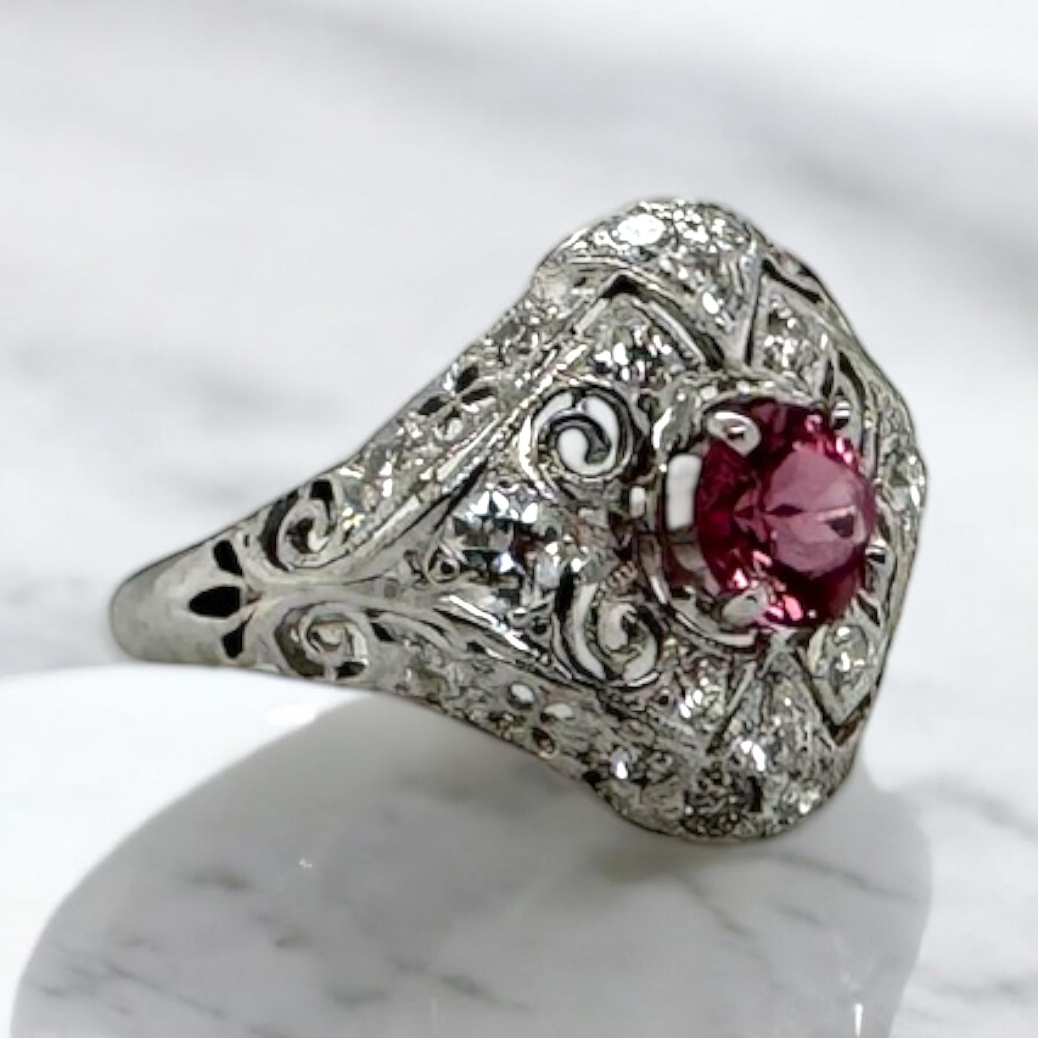 We are loving this vintage pink beauty!!

Ring Details
Material: Platinum
Era: Art Deco 1920 - 1940
Head Length: 16.2mm
Head Height: 6.5mm
Shank Width: 1.7mm
Weight: 5.6 Grams
Finger Size: 6 3/4
Sizable Upon Request

Accented by the following
