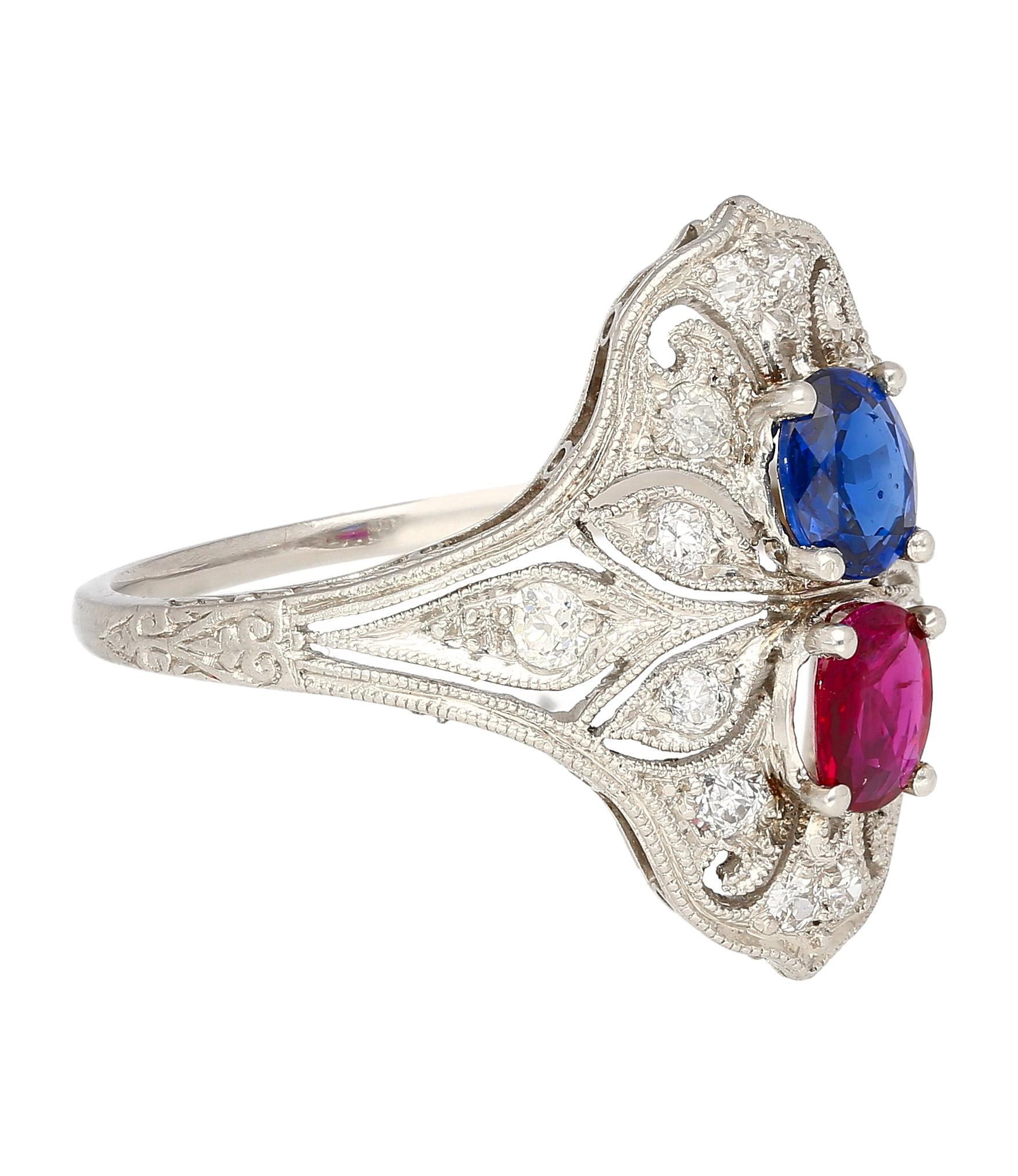 This ring showcases a captivating interplay of color and light. A mesmerizing oval sapphire, boasting 0.48 carats, shimmers with a blue hue. Its brilliance is complemented by a fiery counterpart: an oval ruby radiating 0.33 carats of deep pink. 14