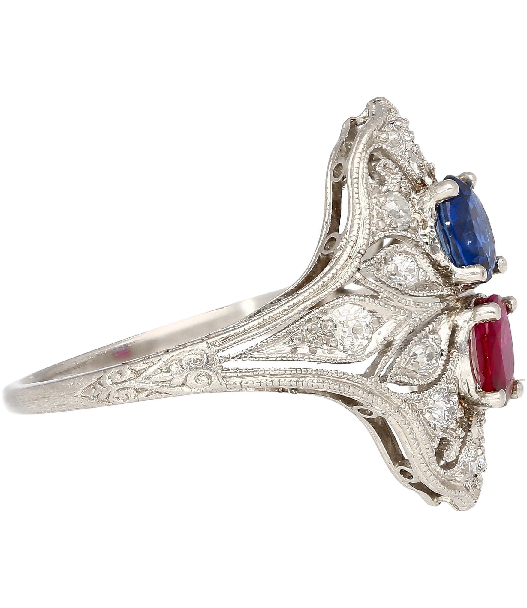 This ring showcases a captivating interplay of color and light. A mesmerizing oval sapphire, boasting 0.48 carats, shimmers with a blue hue. Its brilliance is complemented by a fiery counterpart: an oval ruby radiating 0.33 carats of deep pink. 14