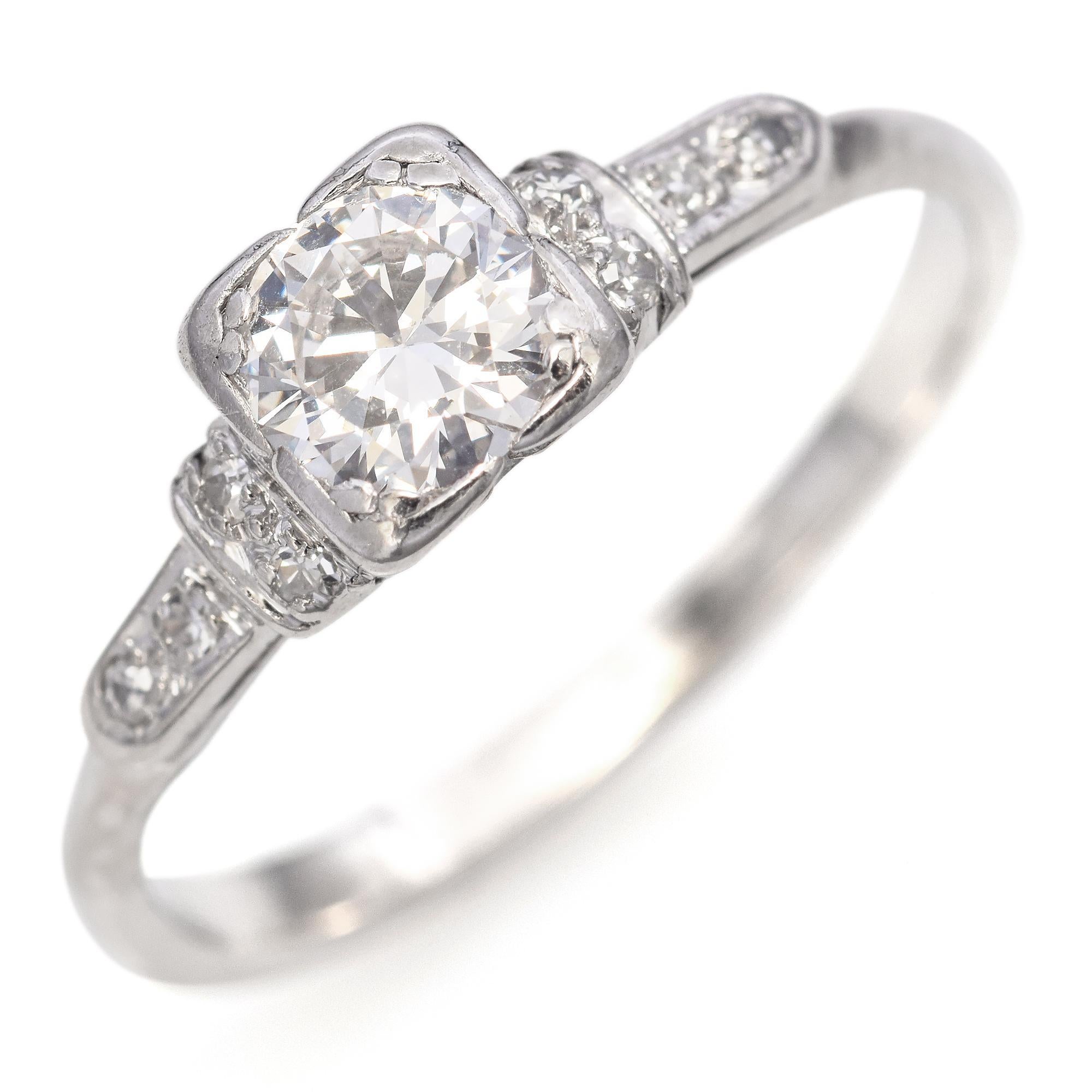 Elegant Vintage Platinum Diamond Engagement Ring.
The top part of the ring was made mid-century and boasts a transitional cut diamond, the shank was later replaced and is made in 14k White Gold.

Weight: 3 grams
Stone: 0.62ct G-H SI2 Transitional