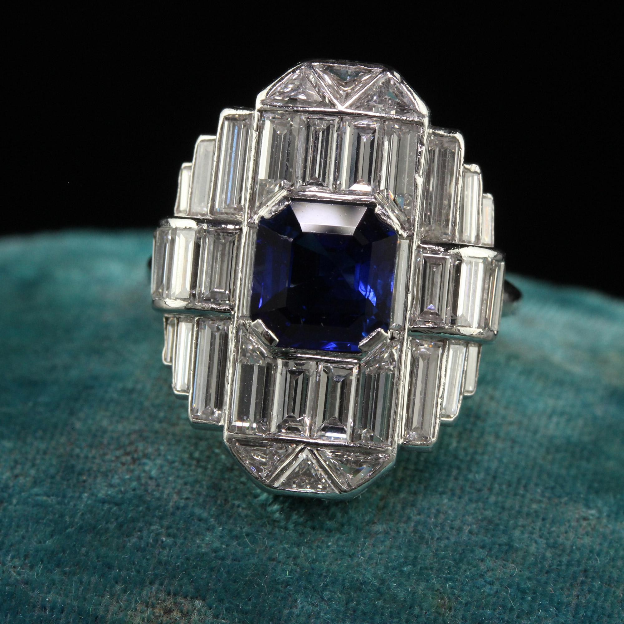 Beautiful Vintage Art Deco Platinum Baguette Diamond and Sapphire Cocktail Ring - GIA. This gorgeous Art Deco cocktail ring is crafted in platinum. The center holds a natural royal blue sapphire that has a GIA report and has white baguette cut