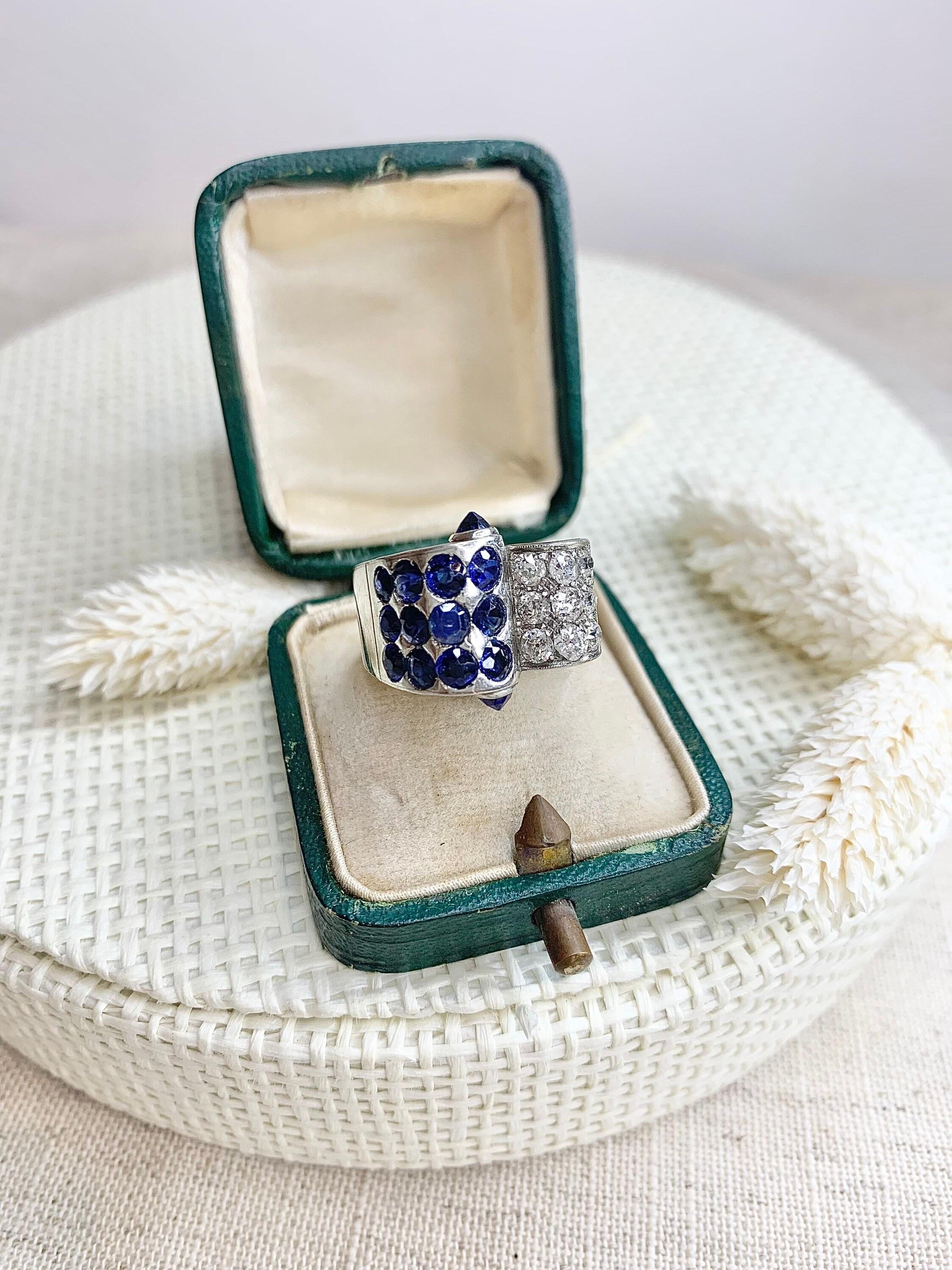 Vintage Sapphire & Diamond Cocktail Ring 

Platinum 

Circa 1940s 

This Ring Definitely Has The Wow Factor!
Set with Gorgeous Blue Sapphires & Fabulous Old Cut Diamonds, The Detail & Design is so Original. This Ring Has Absolute Style! 

UK Size M