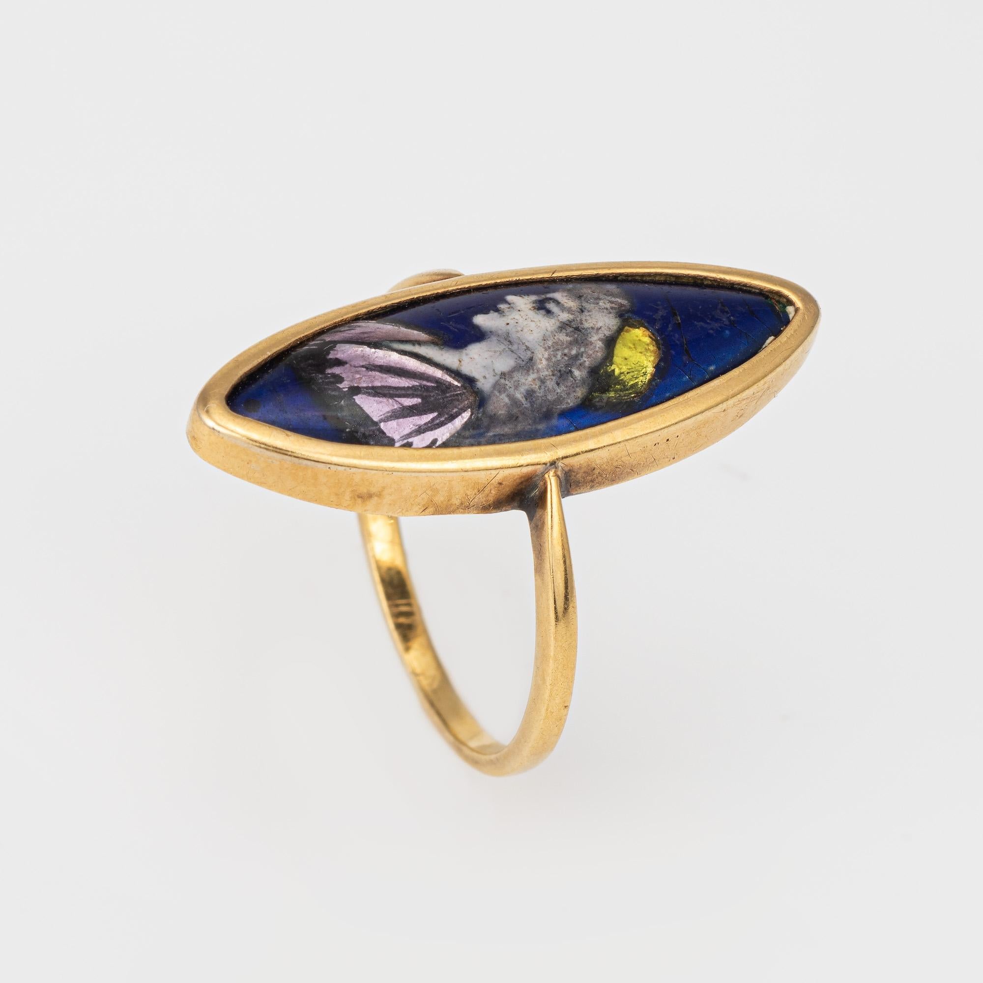 Stylish vintage Art Deco era polychrome enamel portrait ring (circa 1930s) crafted in 18 karat yellow gold. 

Polychrome enamel measures 23mm x 7.5mm. The enamel shows minor abrasions visible under a 10x loupe. 

The portrait of a woman is