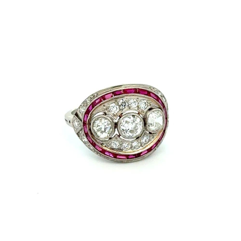 Simply Beautiful! Finely detailed Diamond and Ruby Platinum Vintage Cocktail Ring. Centering securely nestled Hand set 3 Old European Cut Diamonds, weighing approx. 1tcw. Surrounded by .60tcw Rubies and .35tcw Old European Cut Diamonds. Hand crafted