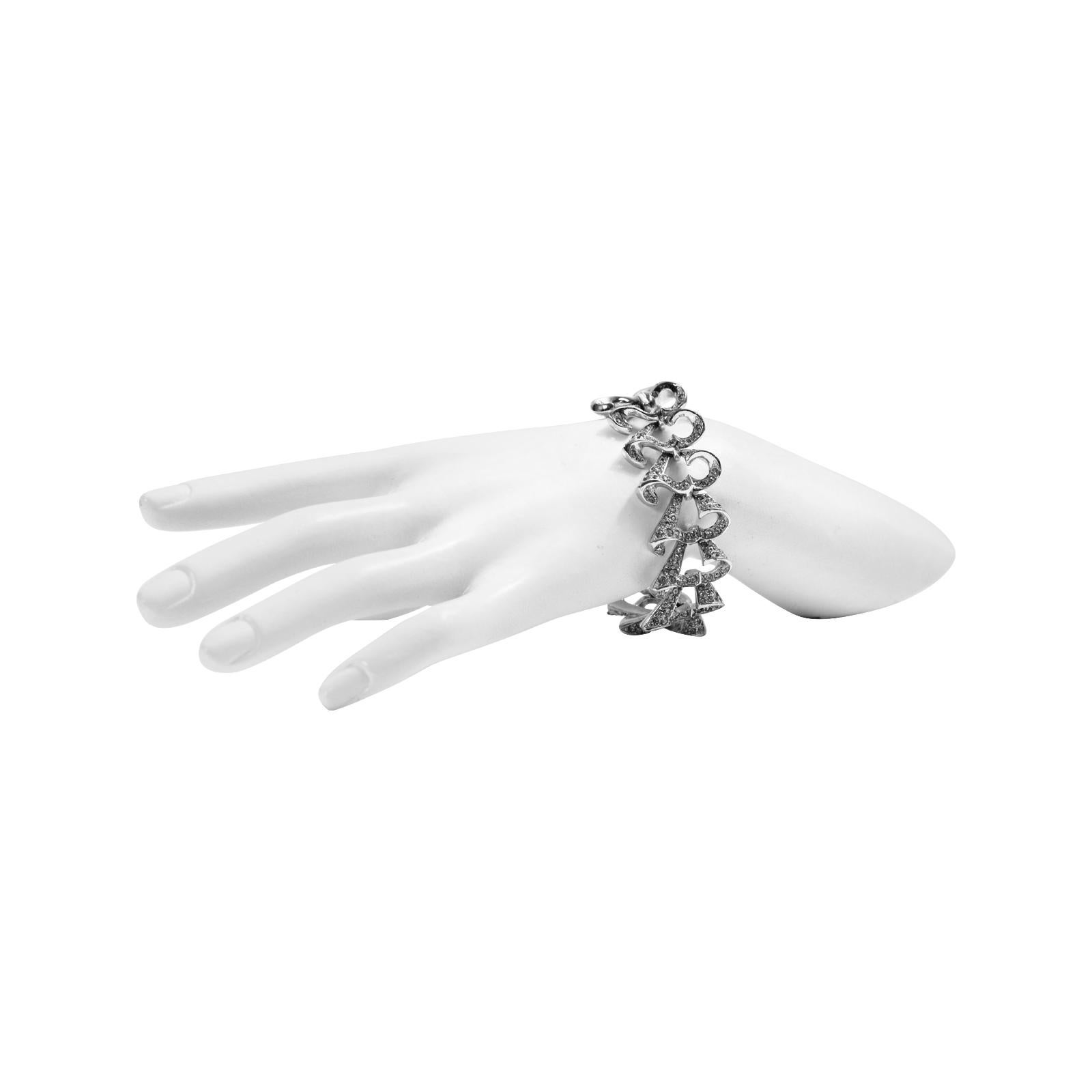 Vintage Art Deco Diamante Bracelet Circa 1960s. This is made of links that curl with diamante on the inside and the outside.  It's a very well-made bracelet.  The finish is in such beautiful shape. Beautiful Art Deco bracelet that pairs perfectly