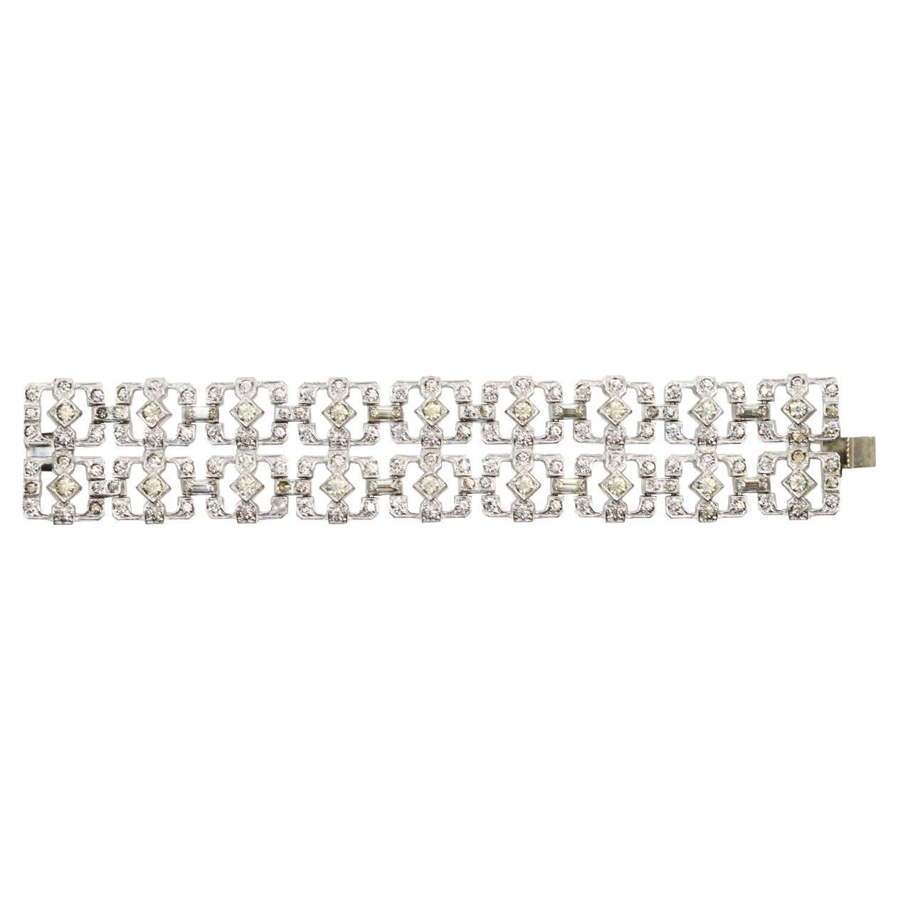 Vintage Art Deco Rhinestone Double Row Bracelet Circa 1960s. Well Made Double Row construction of square boxes make up the pretty bracelet. There are baguettes and round stones that make this bracelet.  I have listed 1960s but this is from the