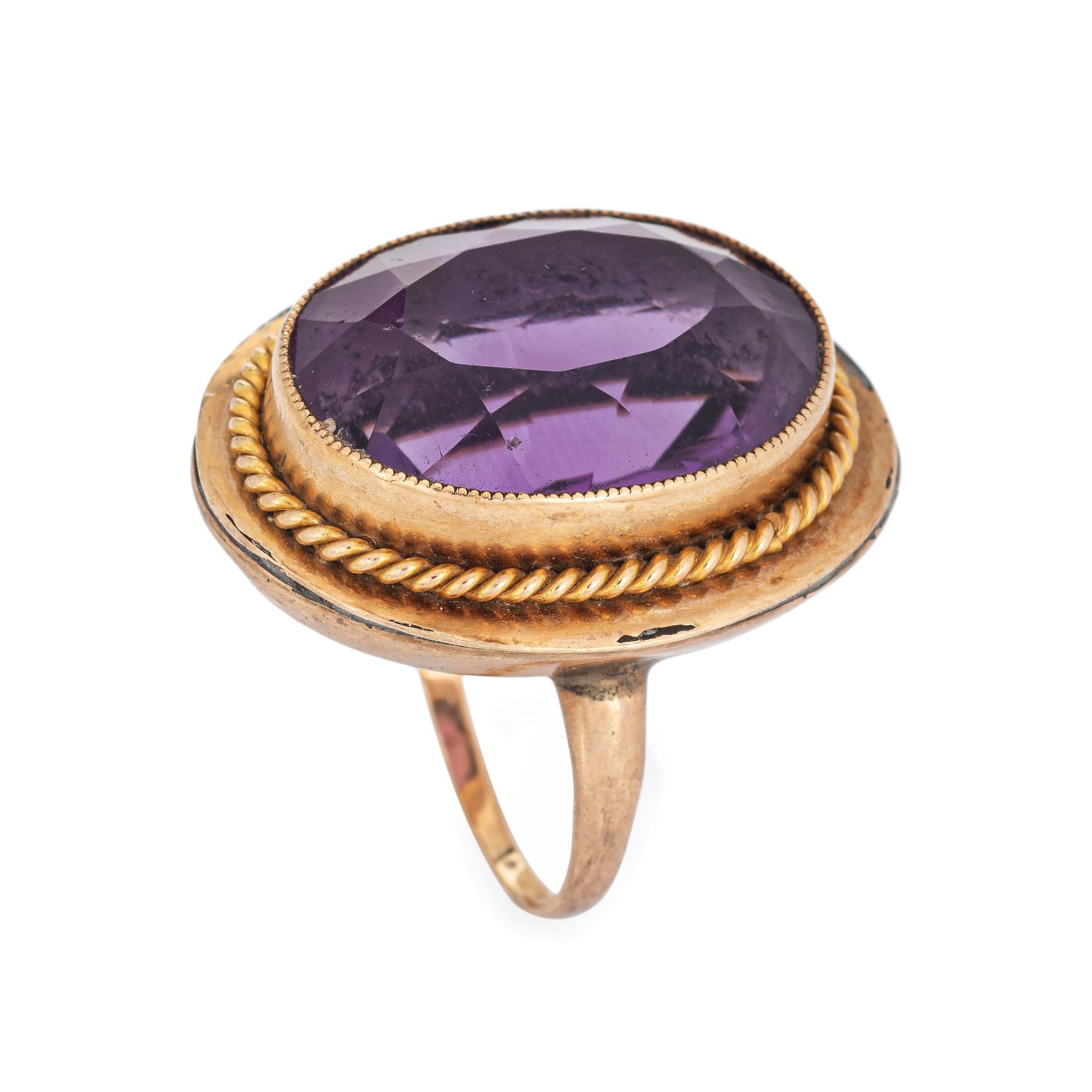 Stylish vintage amethyst cocktail ring (circa 1920s to 1930s) crafted in 10k & 14k karat yellow gold. 

Faceted oval cut amethyst measures 18mm x 13mm (estimated at 12 carats). The amethyst is in good condition with a few light surface abrasions
