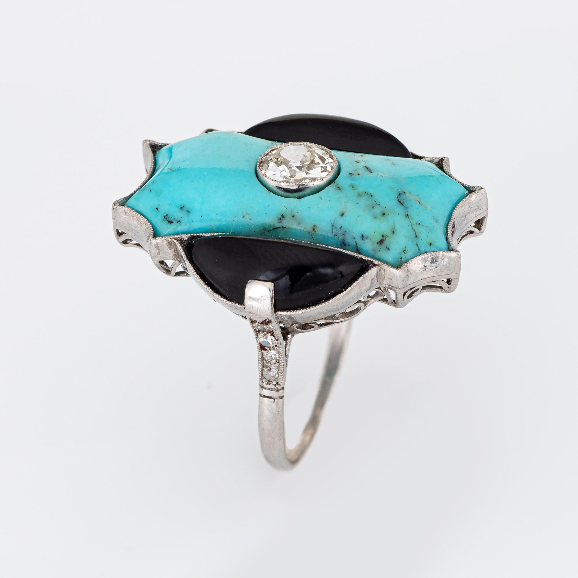 Finely detailed vintage Art Deco diamond, turquoise & onyx cocktail ring (circa 1920s to 1930s) crafted in platinum.

Centrally mounted old European cut diamond is estimated at 0.50 carats (estimated at J-K color and SI1 clarity). Turquoise measures