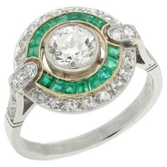 Anello vintage in stile Art Déco con diamanti a taglio europeo antico e smeraldo centrale in platino da 0,73
