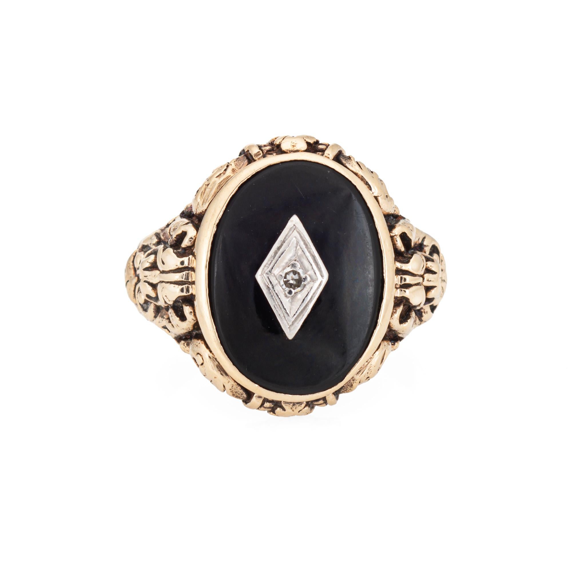 Finely detailed vintage Art Deco onyx & diamond ring (circa 1920s to 1930s) crafted in 10k yellow gold.  

Onyx measures 15mm x 11mm, accented with one estimated 0.01 carat single cut diamonds. The onyx is in good condition with light wear evident