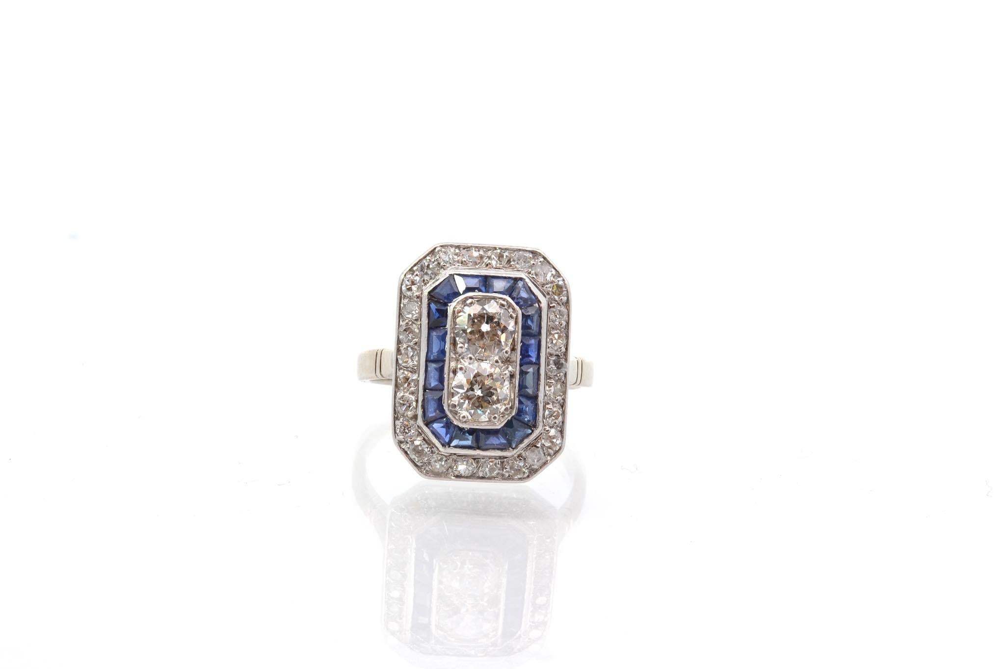 Stones: 2 diamonds: 0.90 ct, 26 diamonds cut 8×8: 0.45 ct and 16 calibrated sapphires: 0.80 ct
Material: Gold and platinum
Weight: 5.4g
Dimensions: 1.8 x 1.3cm
Period: 1920
Size: 52 (free sizing)
Certificate
Ref. :25642