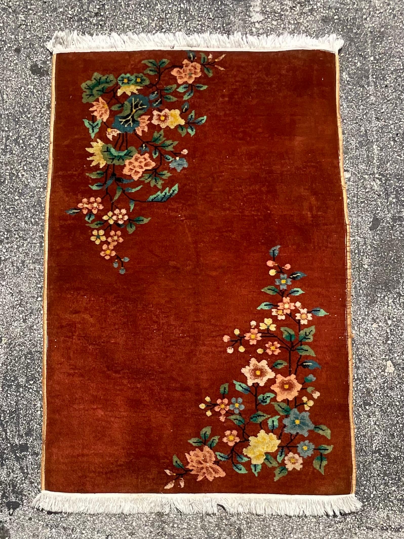 Gorgeous vintage art deco rug in the style of Chinese Nichols. Brightly colored intertwined floral design in two corners that would be a great pop to any room. Acquired from a Palm Beach Estate