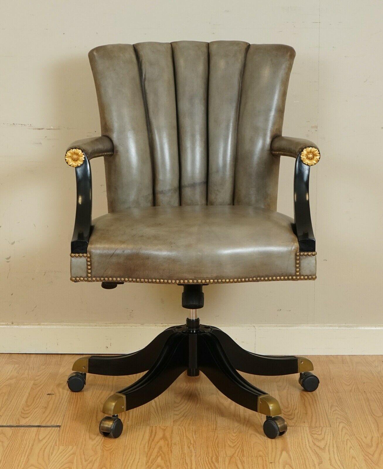 We are delighted to offer for sale this stunning vintage Art Deco shell back leather swivel chair.
A very well made and comfortable chair. The armrest and base are black Lacquered with a gold design in front of the armrest.

These are quite rare