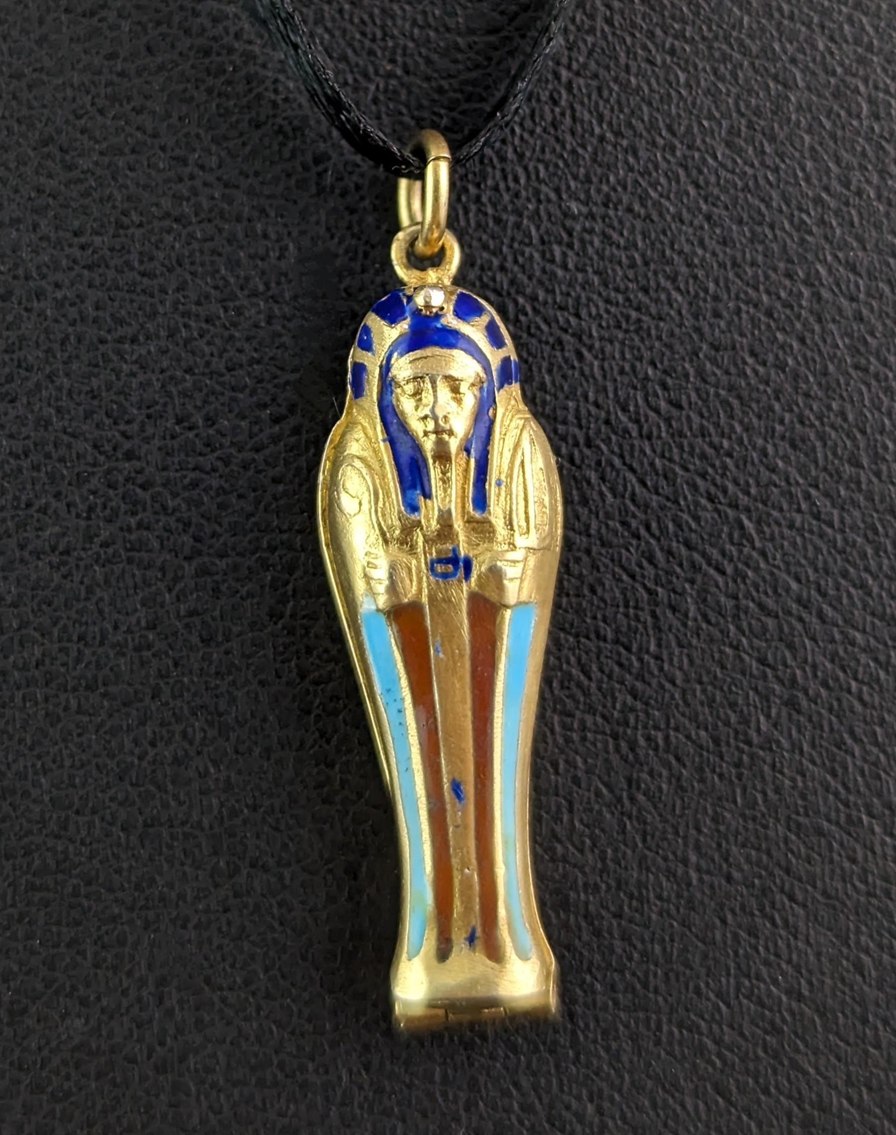 A fun vintage Art Deco silver gilt and enamel sarcophagus pendant.

A relic of the Egyptian revival era in the 1920s when everything Egyptian was the height of fashion and wonder.

This vintage silver gilt pendant is a rich golden gilt in 800 silver
