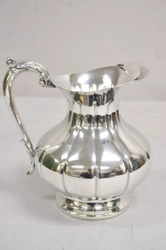 Vintage Art Decó Jarra de agua con pie bulboso y asa plateada