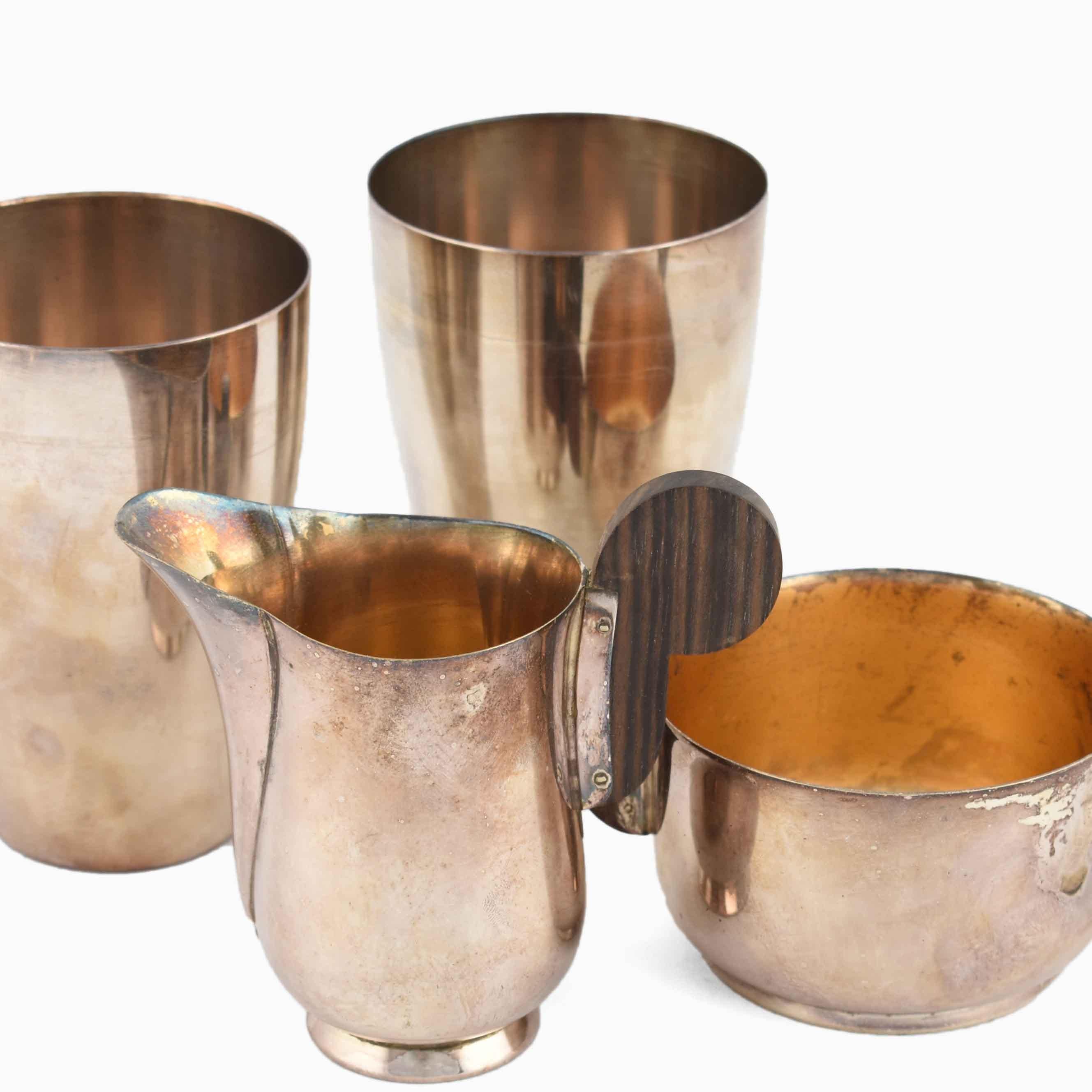 Art Deco silverware is an original decorative group of works realized in the second third of the 20th century.

The group includes: One sugar bowl, one cream bowl and two mugs. 

All the pieces are realized in silver plate.

Realized by WMF in