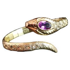 Bracelet jonc serpent Art déco vintage, or roulé, pâte d'améthyste, Andreas Daub