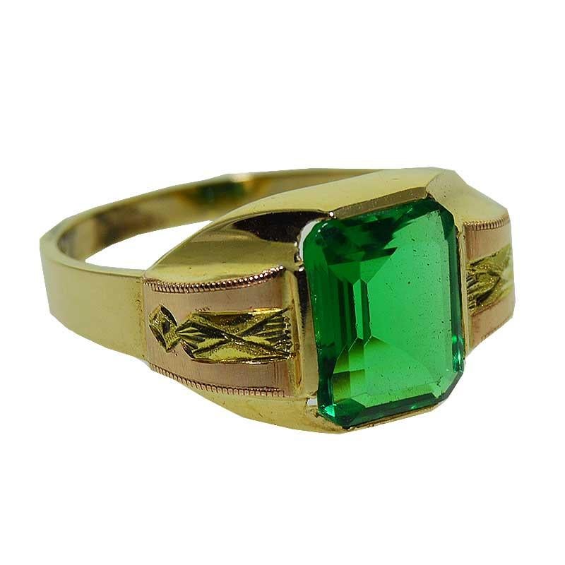 Vintage Art Deco Gent's ring crafted 10Kt Solid Yellow Gold Gent's featuring a bright Shamrock Green, emerald cut man made glass stone. The shoulder of this ring have hand engraved  Rose Gold applique details. This hand constructed ring is unworn,