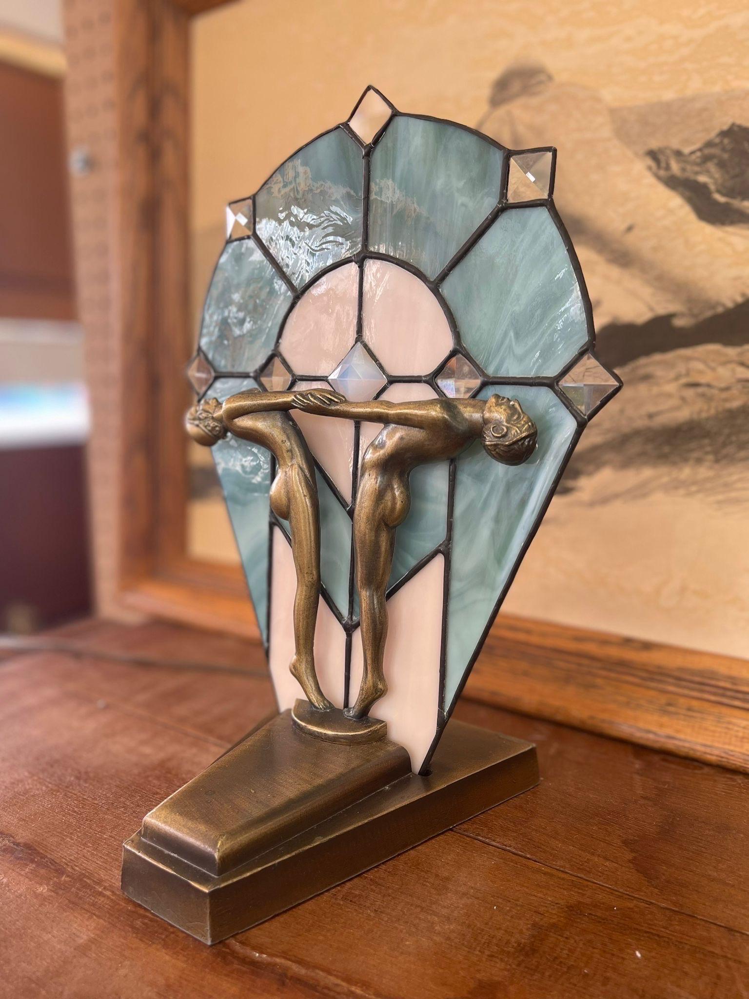 Vintage Art Deco Stained Glass Nude Figurine Blue Lamp possibly Bronze. ( Non Operational )

Dimensions. 10 W ; 6 1/2 D ; 14 H