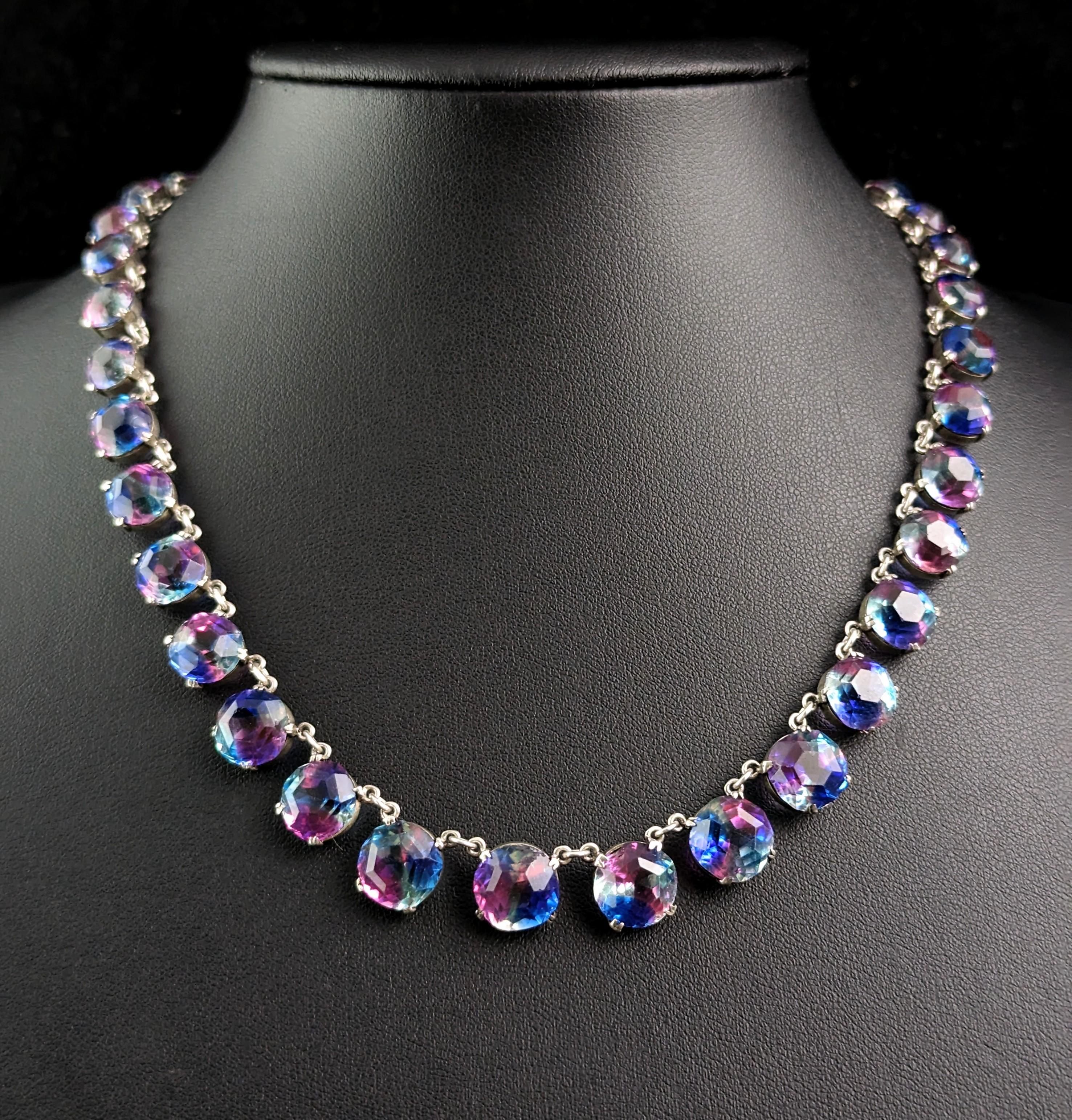 A vintage paste Riviere necklace is a fantastic addition to any vintage jewellery collection, even moreso when it is made from the wonderfully pretty Iris glass.

This necklace has all the sparkle without the price tag making it the perfect piece to