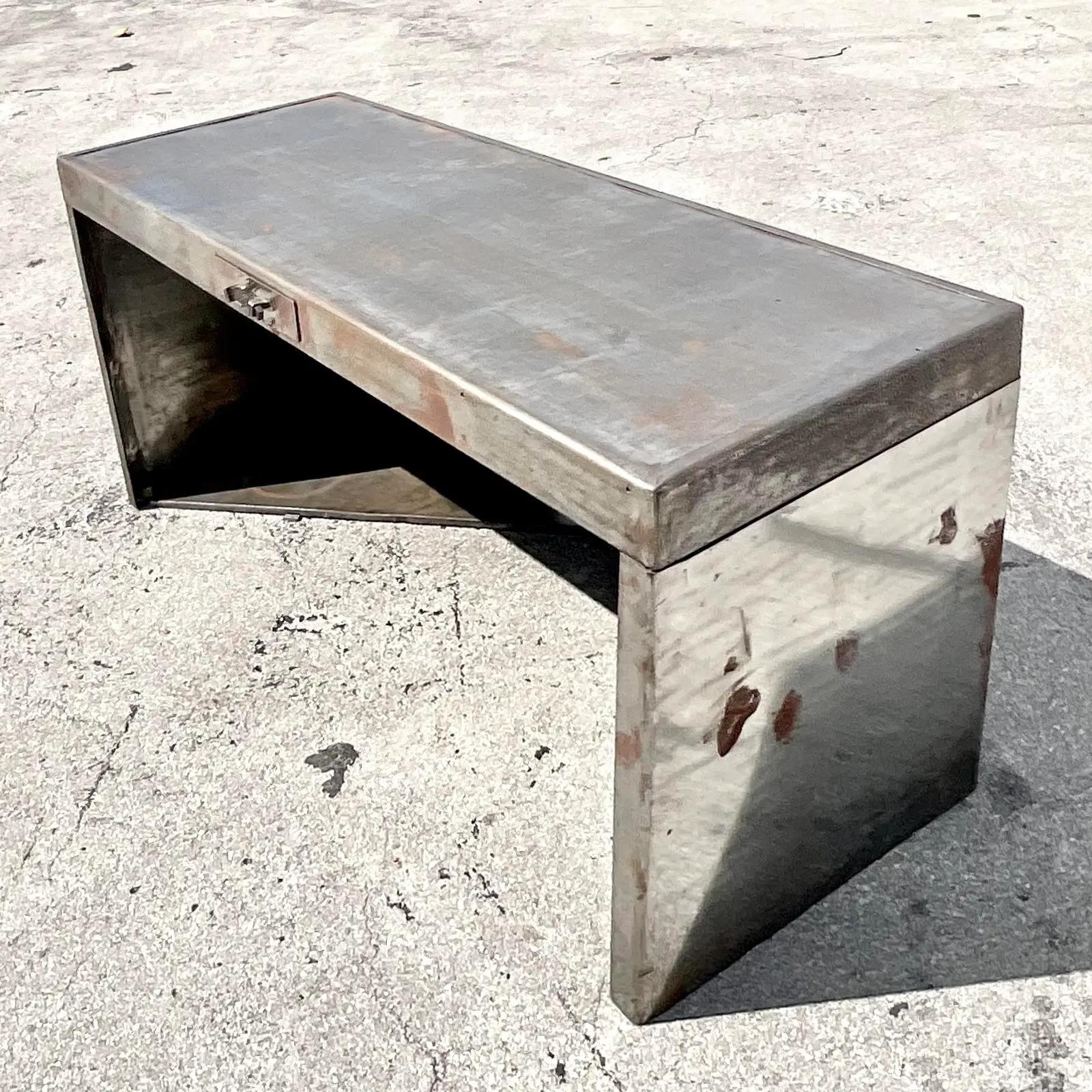 An incredible vintage Art Deco desk. A great example of The Machine Age. Simple and stream line in its design. All over gnarly patina from time. Acquired from a Miami estate.