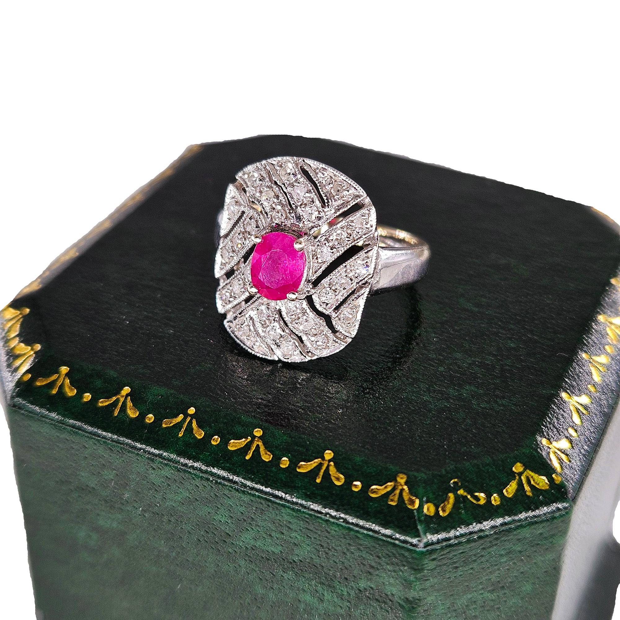 Vintage Art Deco Style 0.75Carat Oval Ruby and Diamond 14k White Gold Ring
A radiant bright oval ruby centers this striking and sparkling Vintage Art Deco style ring expertly crafted in 14k White Gold and is adorned with exceptionally rendered hand
