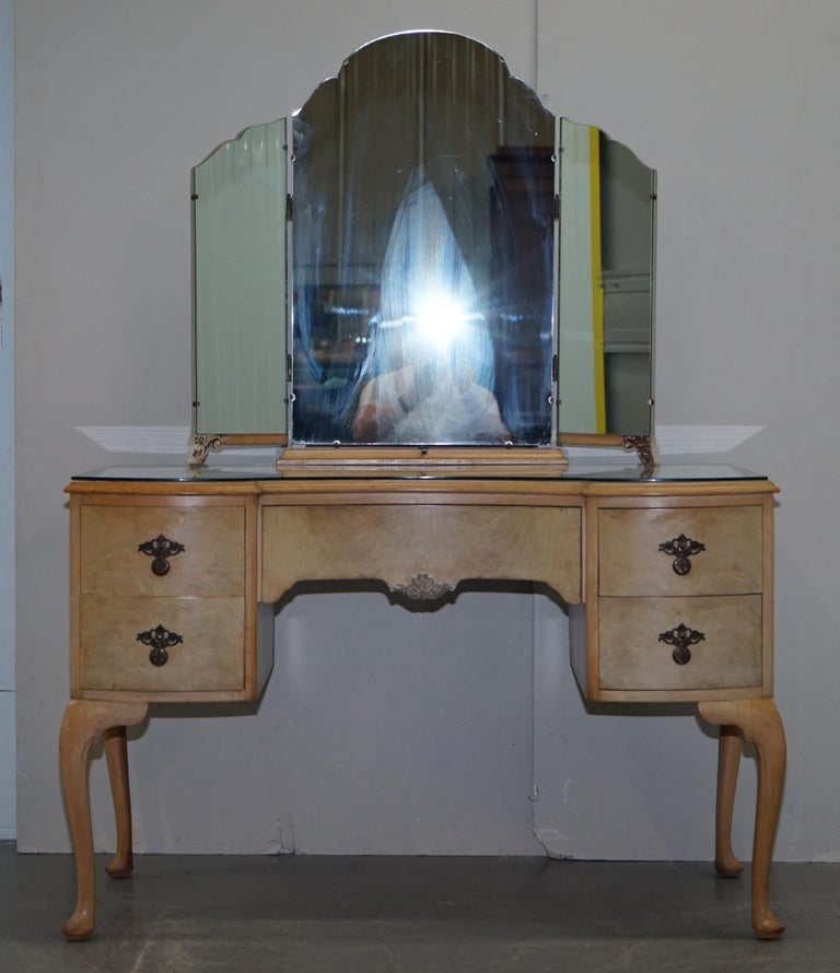 We are delighted to offer for sale this lovely Art Deco style burr light walnut dressing table with tri fold mirrors which is part of a suite 

This piece is very well made indeed, the timber patina is sublime, it looks very French Deco! The