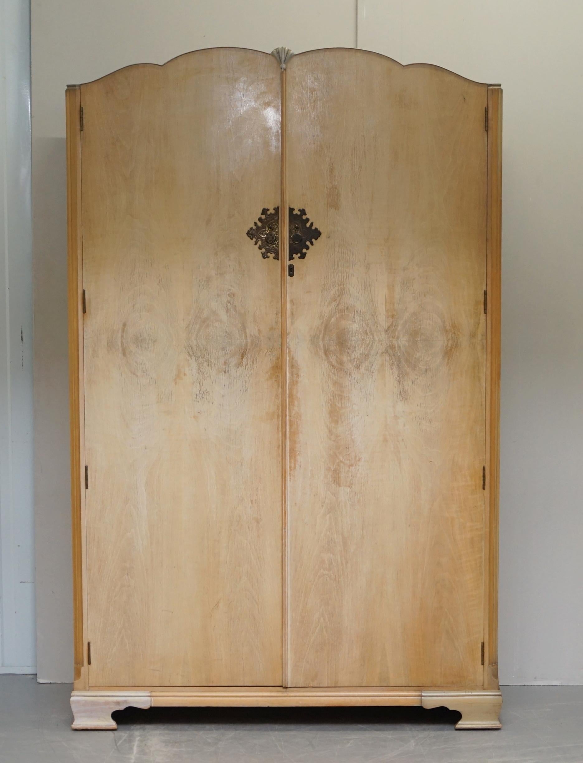 We are delighted to offer for sale this lovely Art Deco style Burr light Walnut double wardrobe which is part of a suite 

This piece is very well made indeed, the timber patina is sublime, it looks very French Deco! Inside you find two large