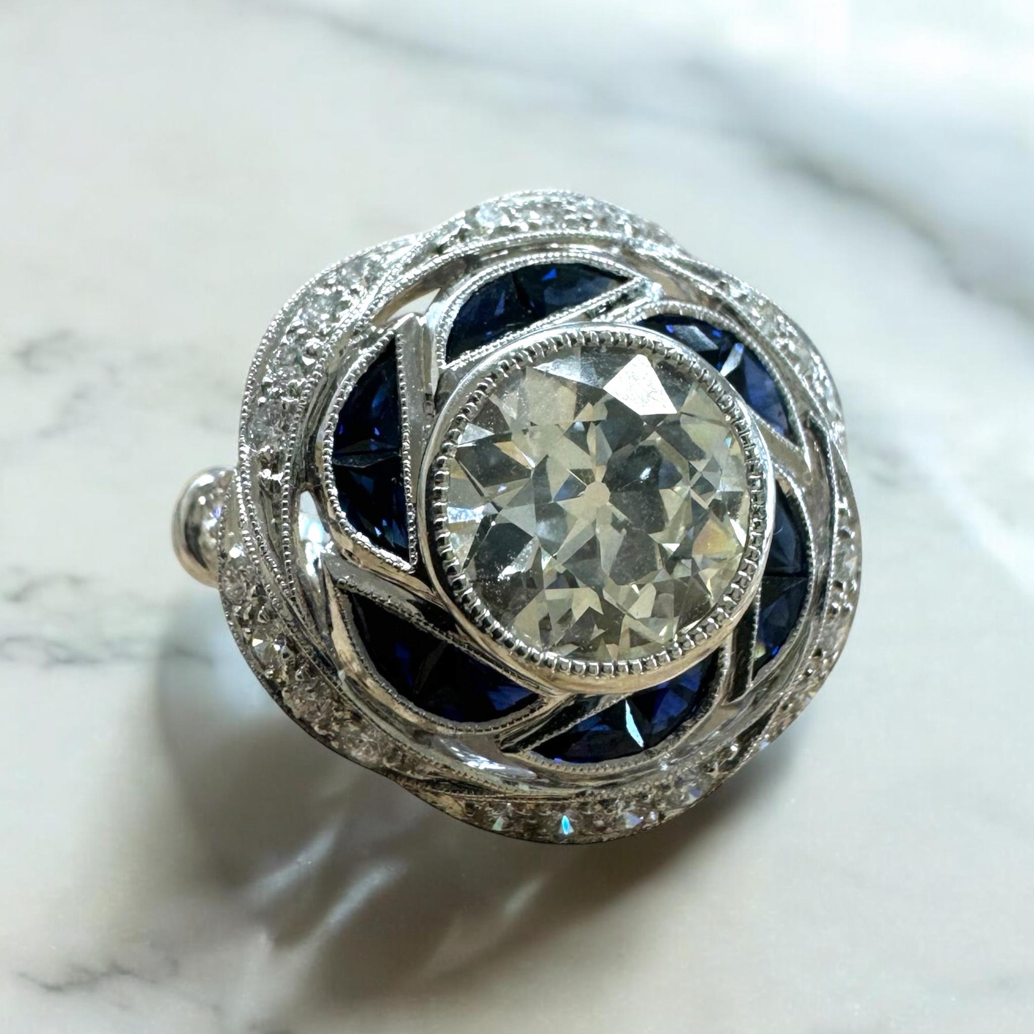 We are charmed by the looks of this beauty!!

Ring Details
Material: 14K White Gold
Head Width: 19.2mm
Head Height: 6mm
Shank Width: 2.4mm
Weight: 6.5 Grams
Finger Size: 6
Sizable Upon Request

Accented by the following gemstones
1 - 8.25mm X 8.46mm